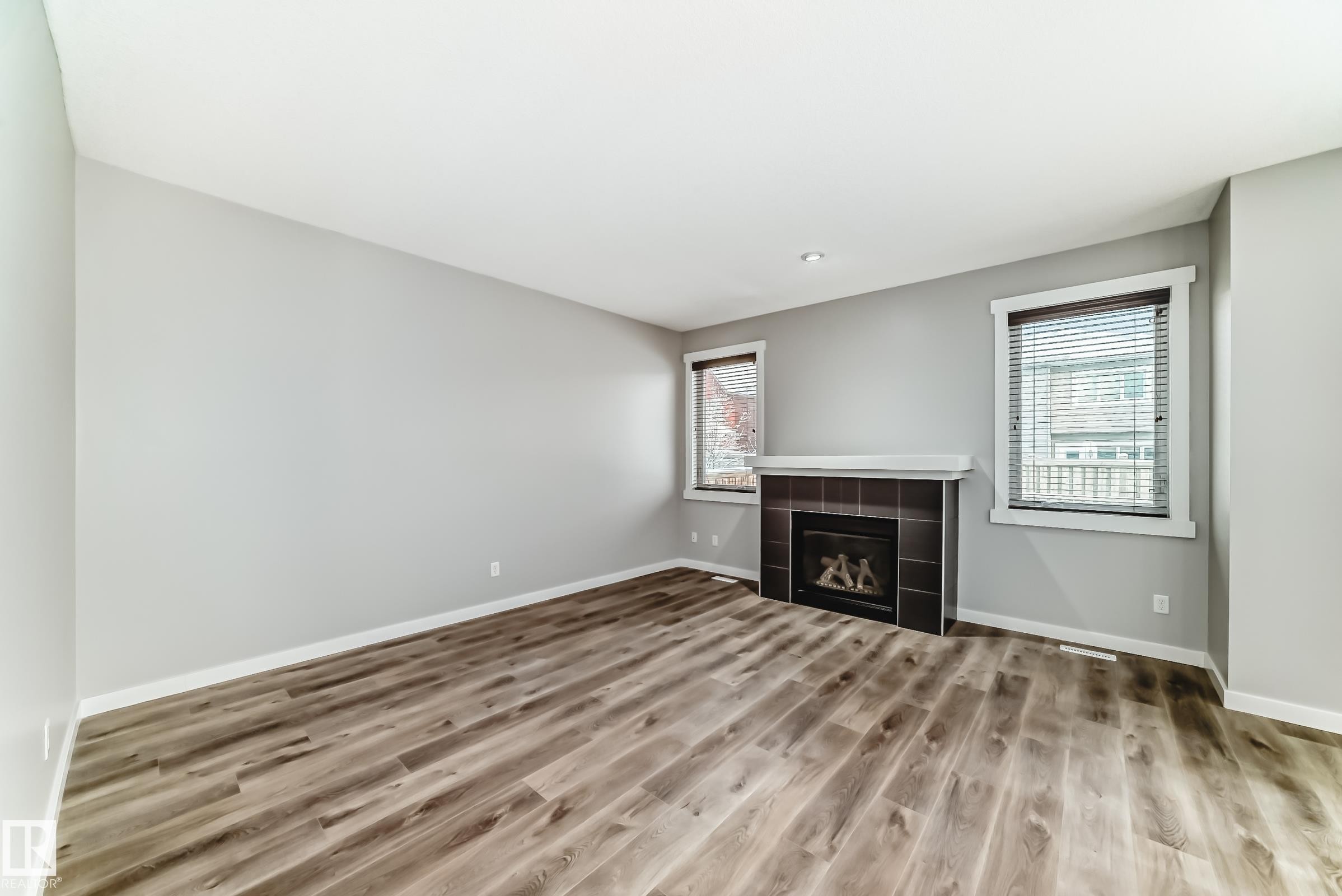 Edmonton, AB - Indoor Photo Showing Other Room With Fireplace