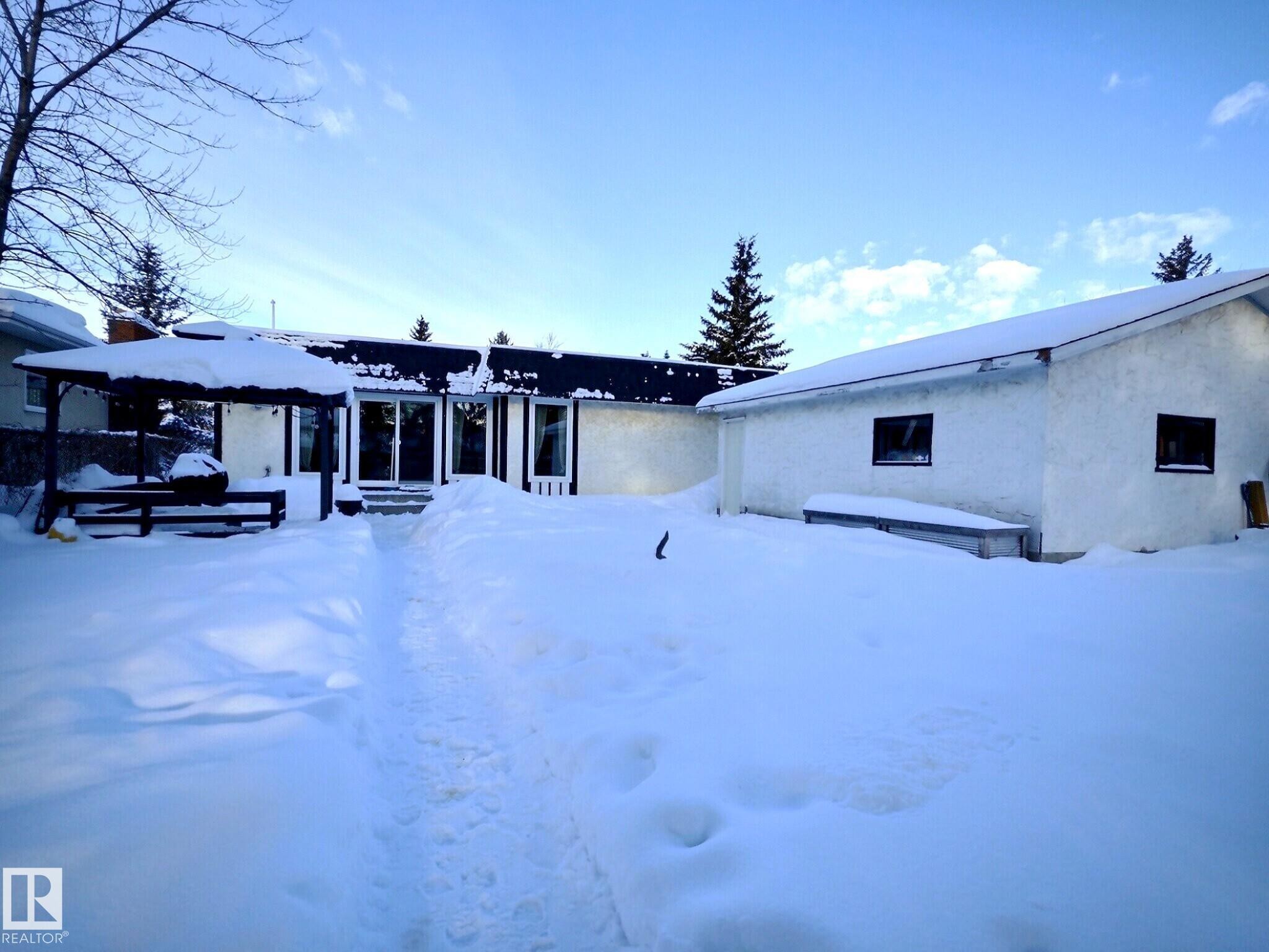 Snow covered rear of property with stucco siding - 17119 82 Avenue, Edmonton, AB - Outdoor