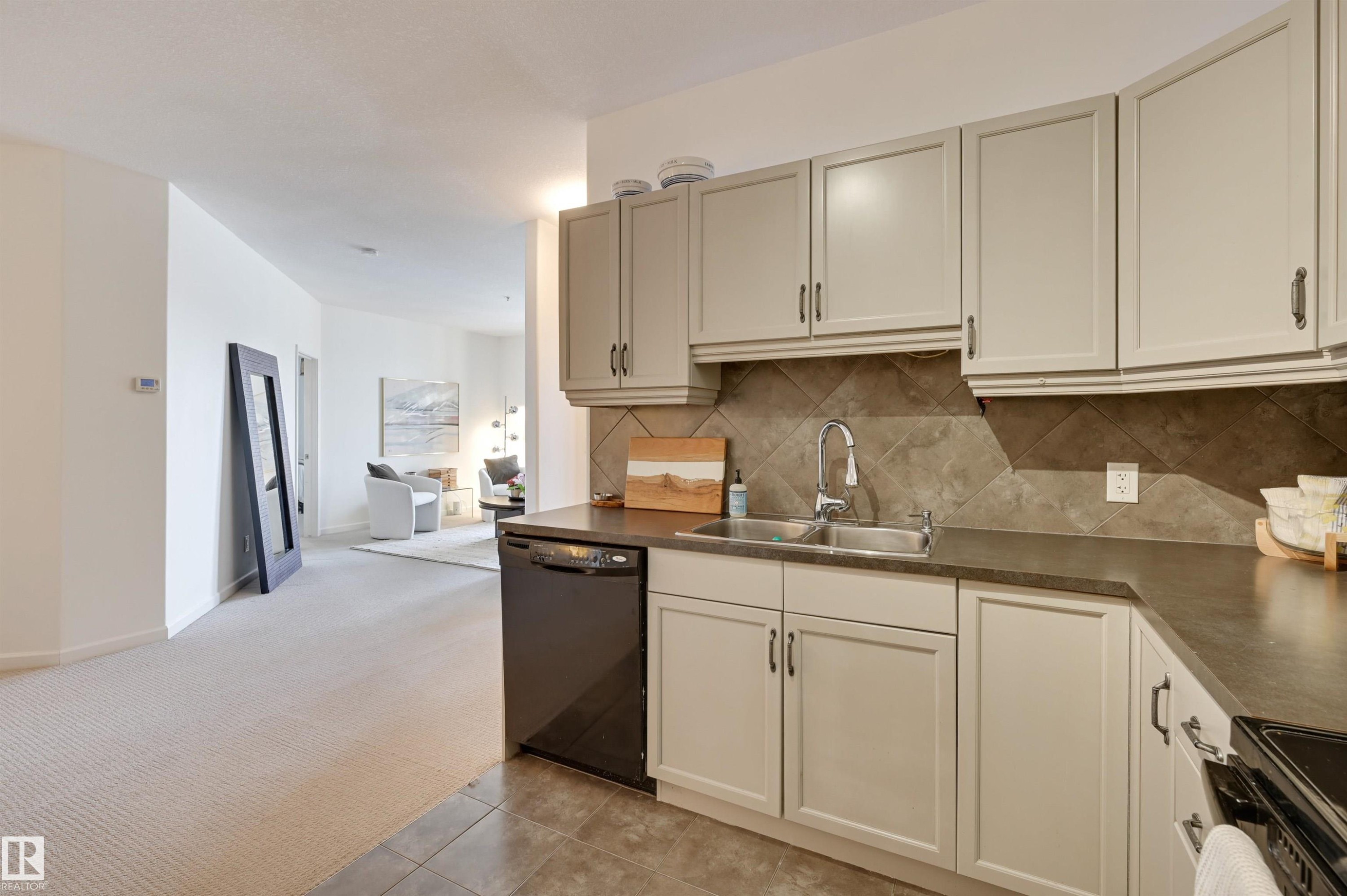 221 6083 Maynard Way, Edmonton, AB - Indoor Photo Showing Kitchen With Double Sink
