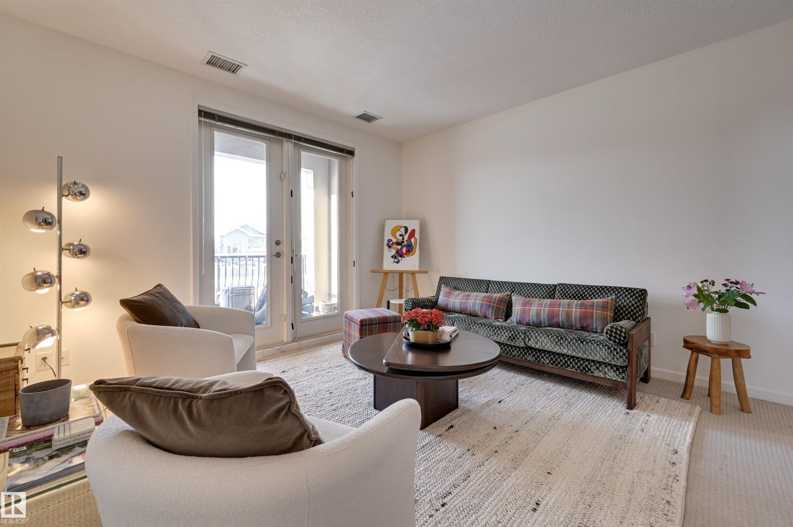 221 6083 Maynard Way, Edmonton, AB - Indoor Photo Showing Living Room