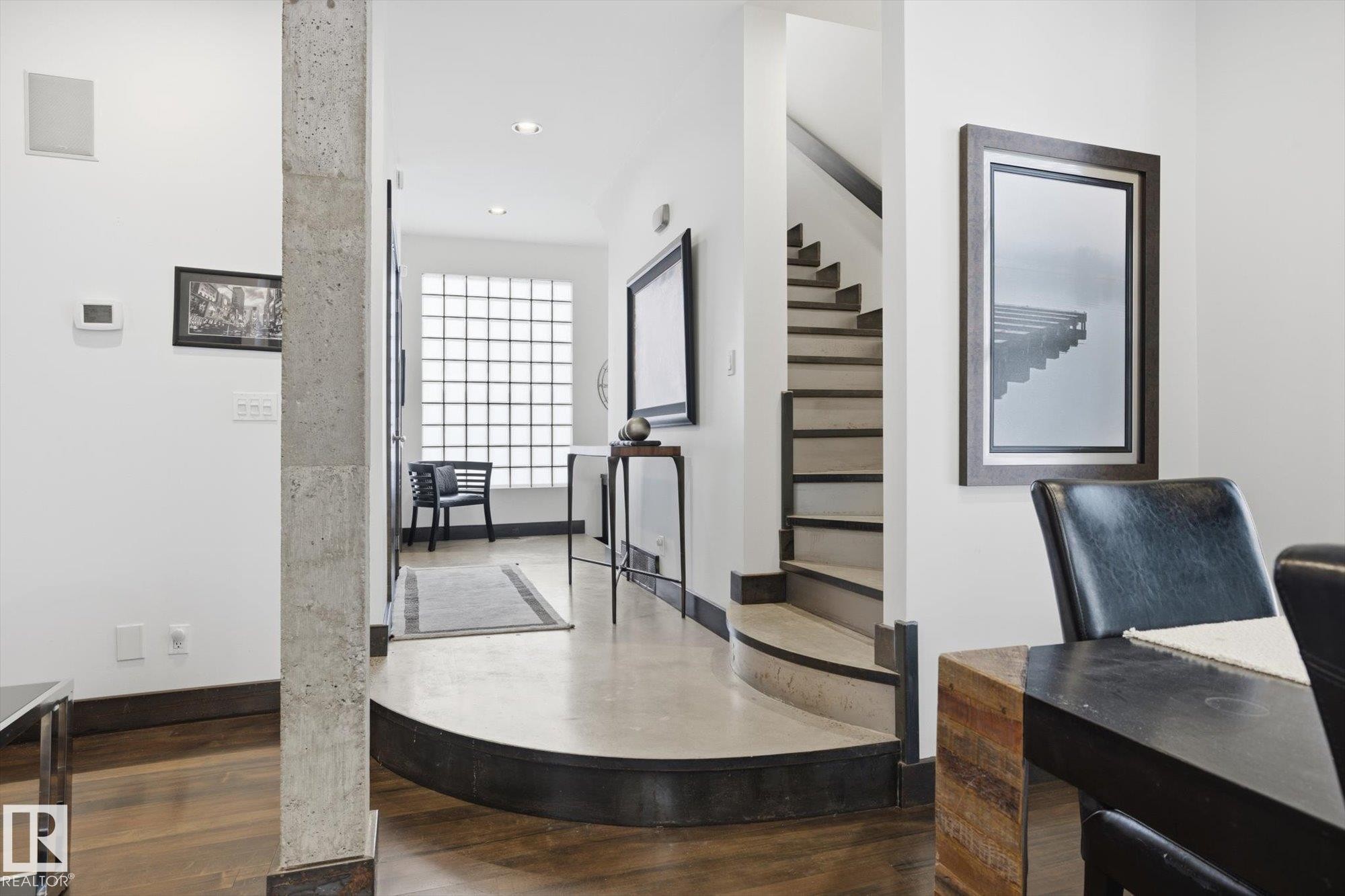 Hall featuring recessed lighting, dark wood-type flooring, and stairs - 9012 98 Street, Edmonton, AB - Indoor
