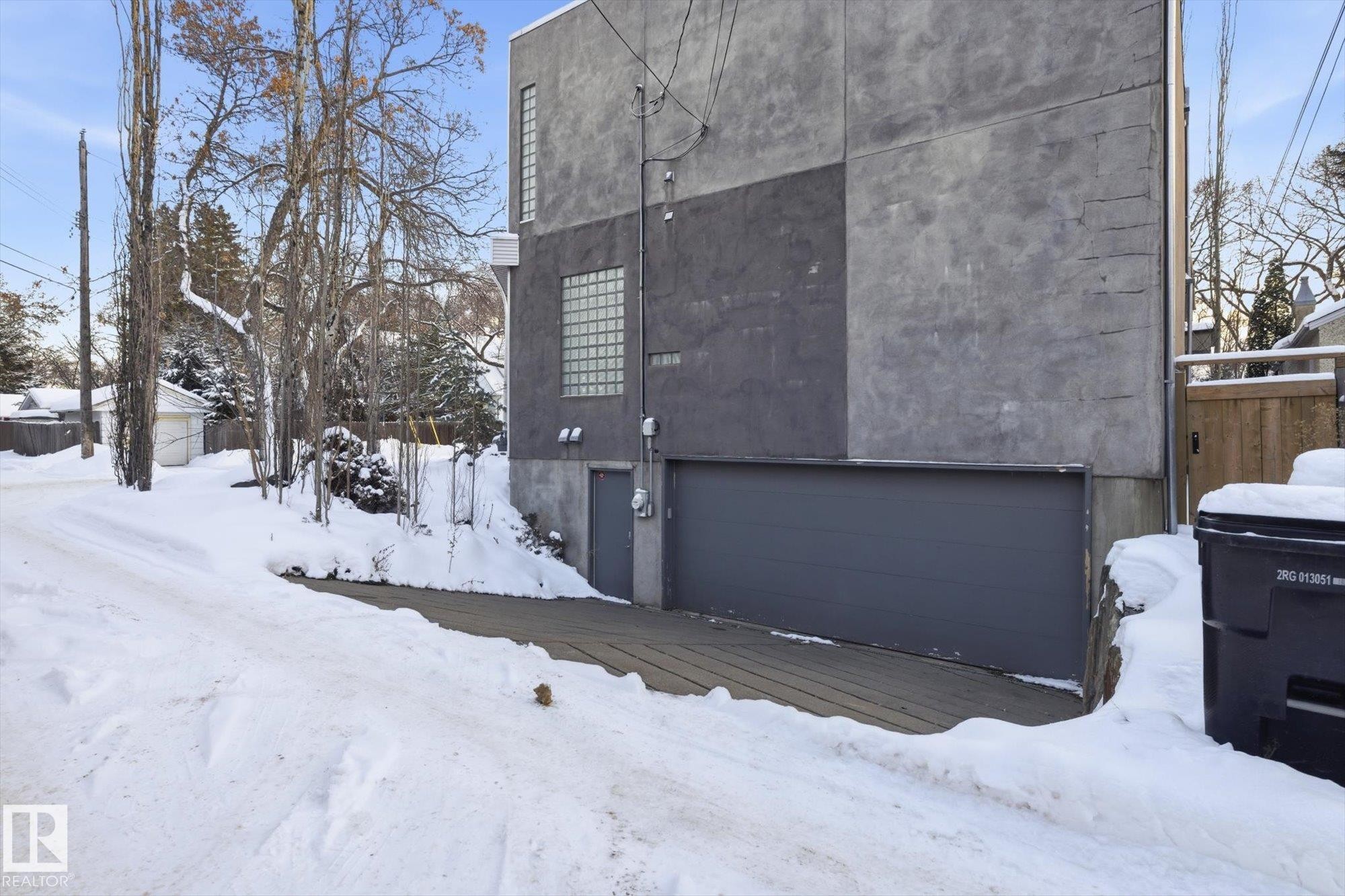 Snow covered property featuring an attached garage - 9012 98 Street, Edmonton, AB - Outdoor