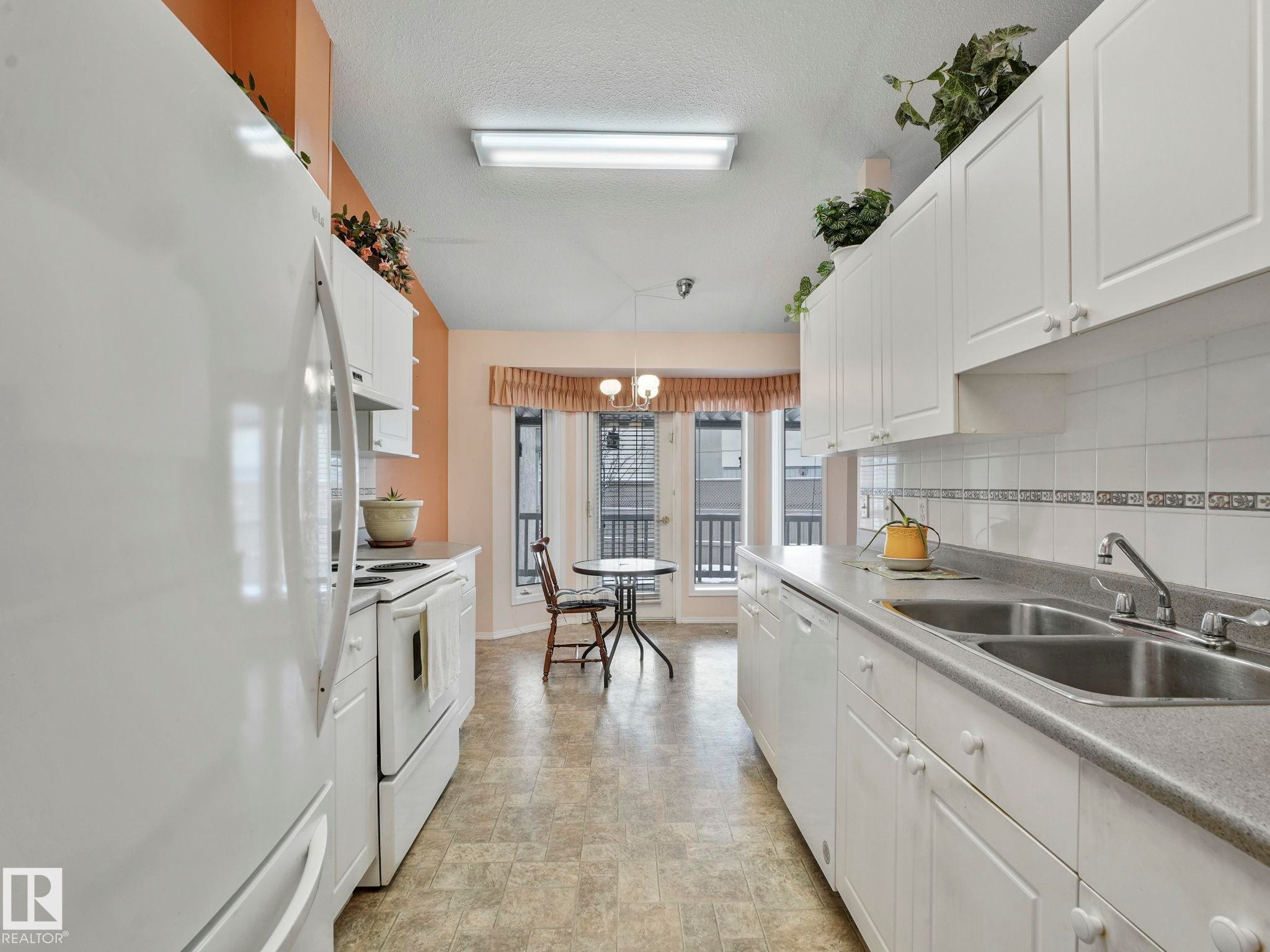 Edmonton, AB - Indoor Photo Showing Kitchen With Double Sink