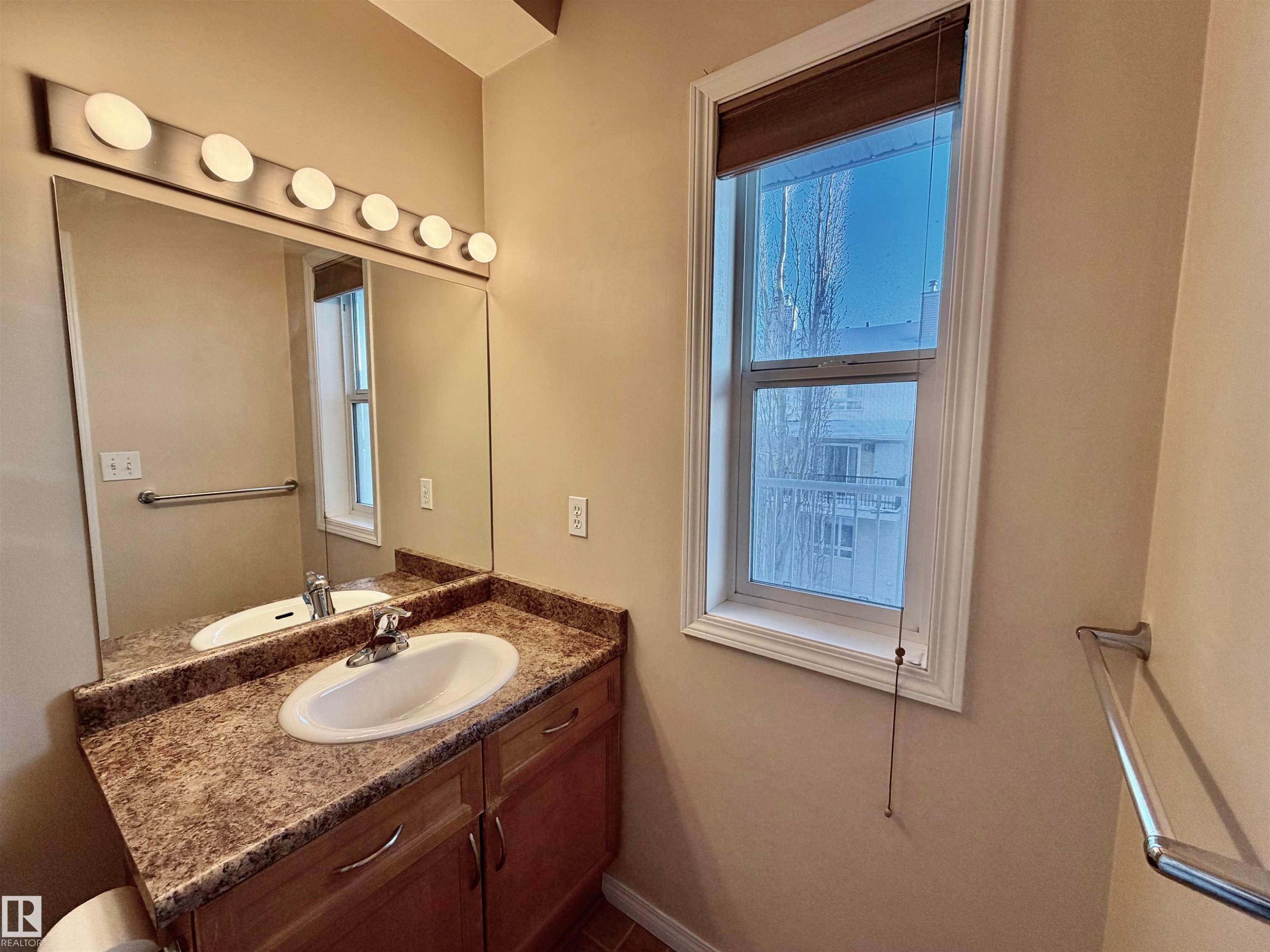 Bathroom with vanity and plenty of natural light - 321 4304 139 Avenue, Edmonton, AB - Indoor Photo Showing Bathroom