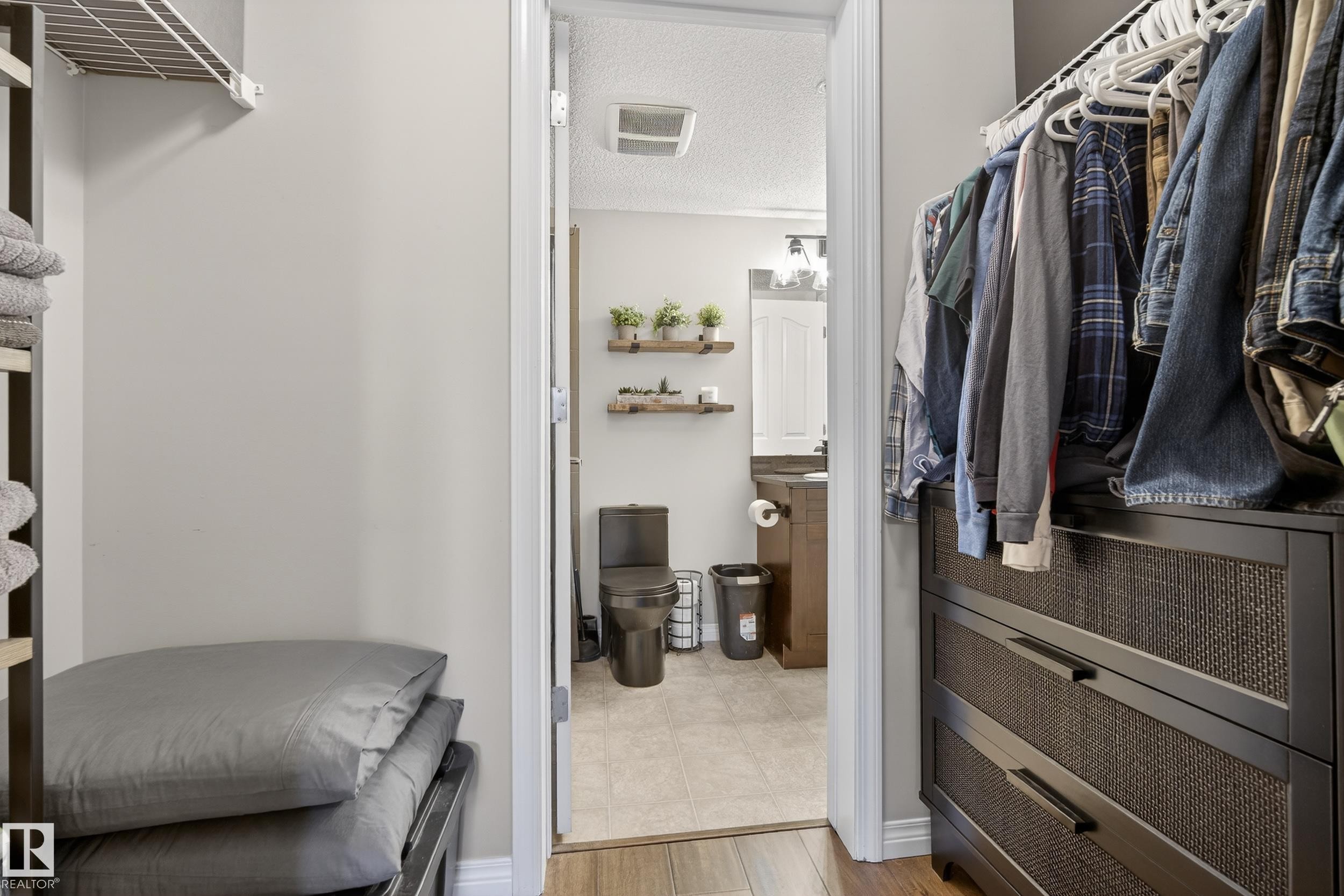 Walk in closet with light wood finished floors - 108 534 Watt Boulevard, Edmonton, AB - Indoor With Storage