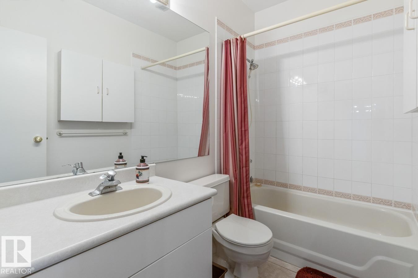 Full bathroom featuring vanity and shower / bath combination with curtain - 6508 109 Avenue, Edmonton, AB - Indoor Photo Showing Bathroom