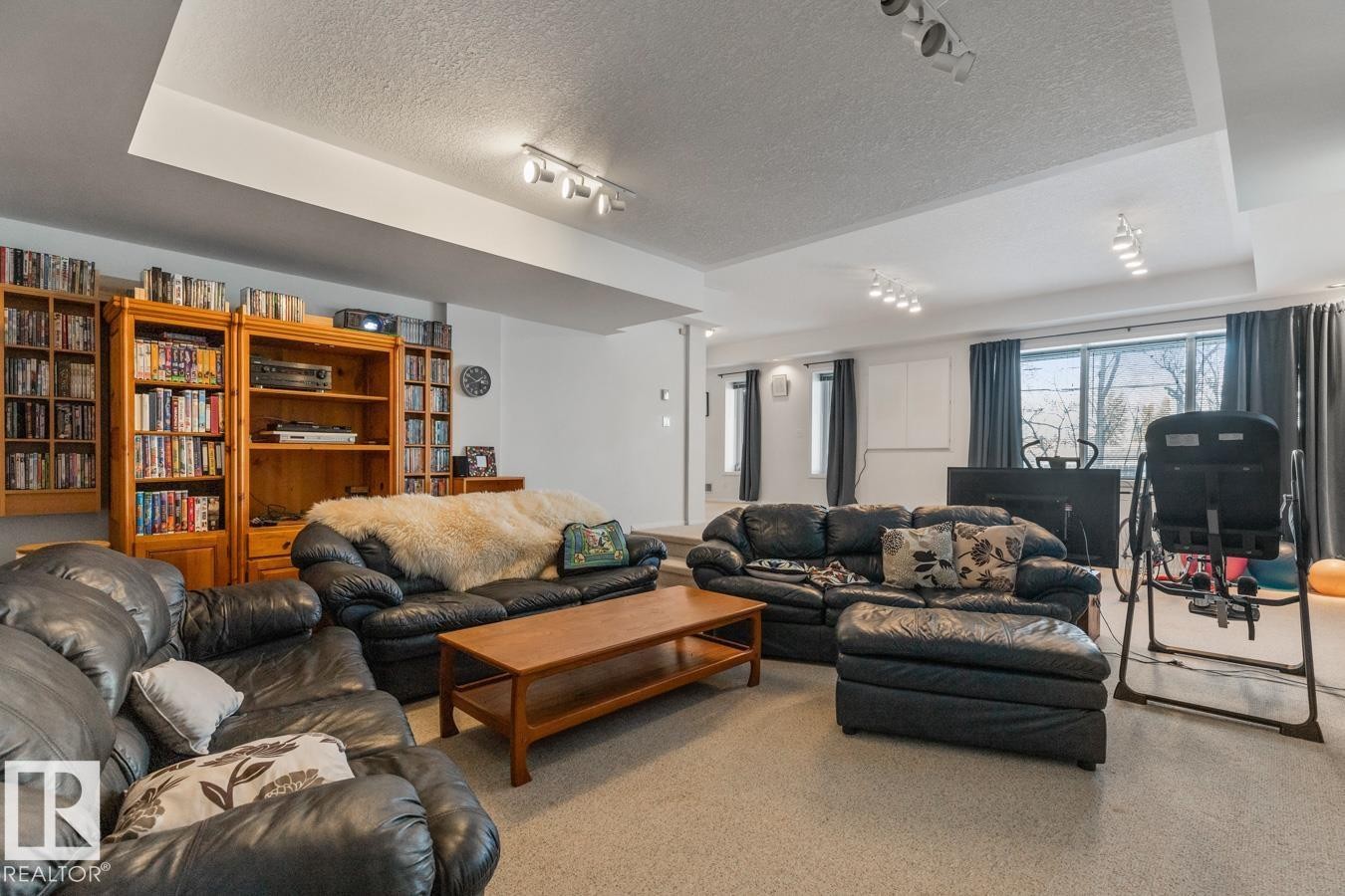 Living area featuring a textured ceiling and carpet flooring - 6508 109 Avenue, Edmonton, AB - Indoor Photo Showing Living Room
