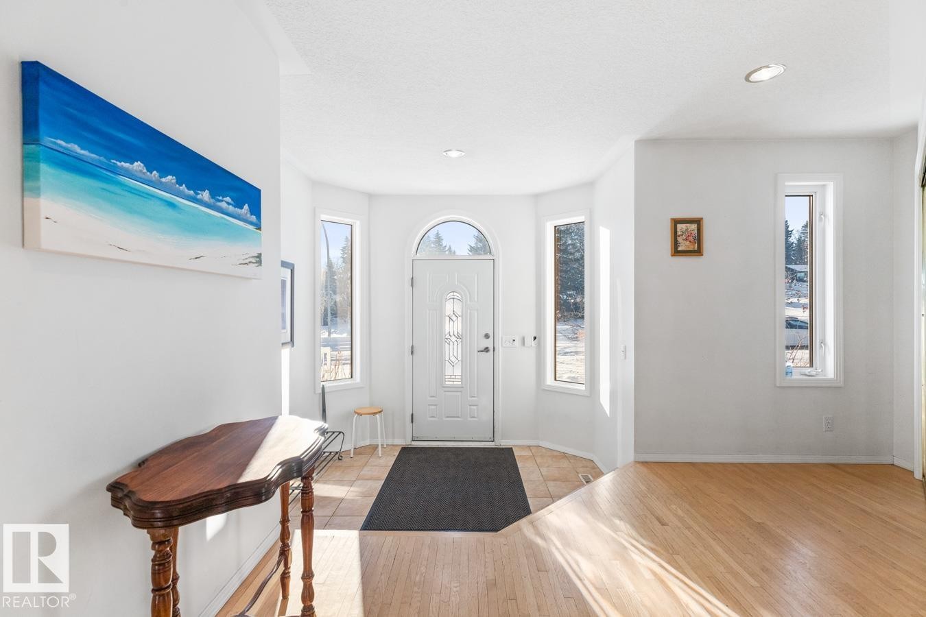 Entrance foyer featuring light wood-type flooring and a textured ceiling - 6508 109 Avenue, Edmonton, AB - Indoor Photo Showing Other Room
