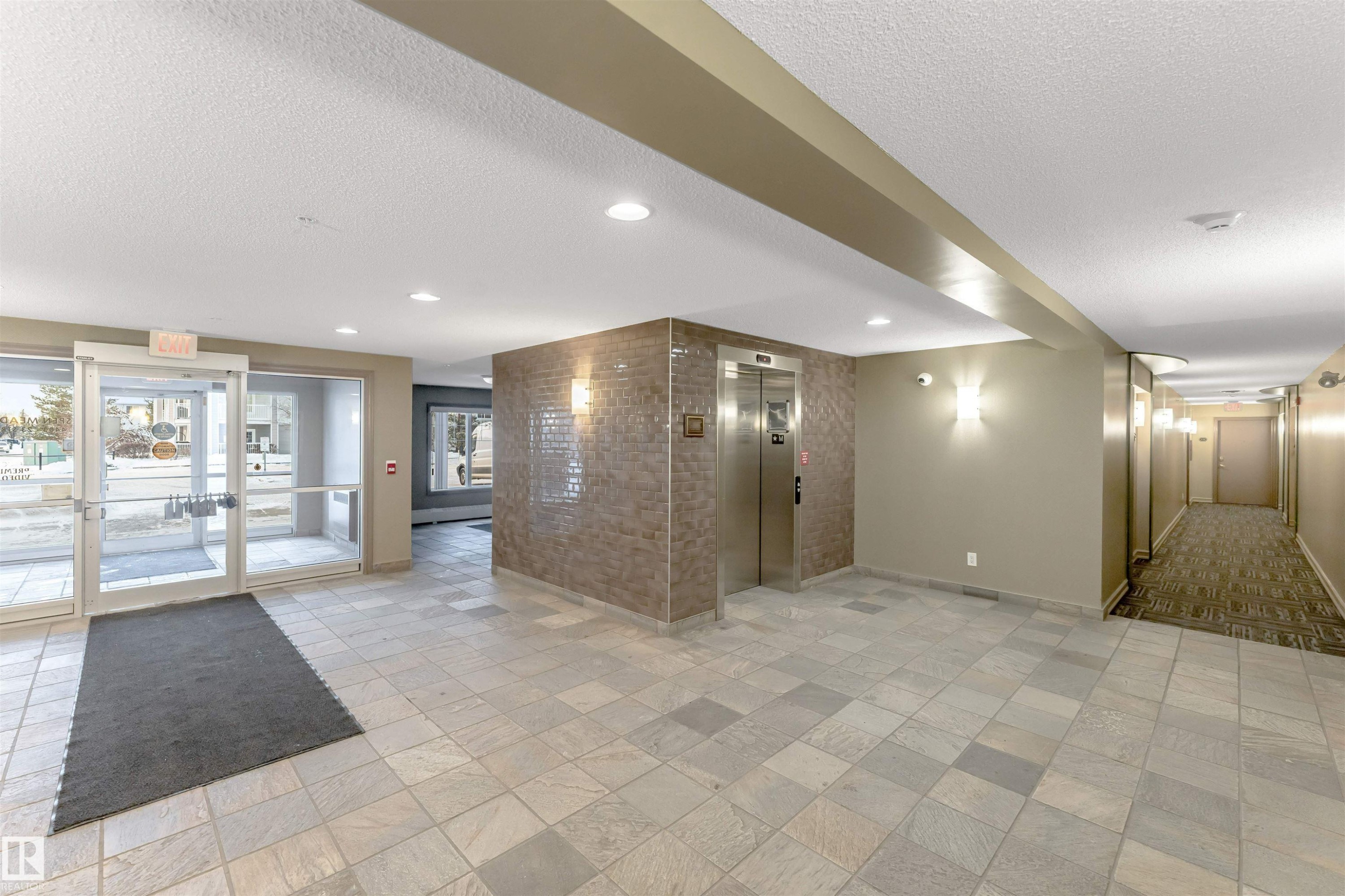 Common area featuring a textured ceiling and recessed lighting - #201 4403 23 Street Nw, Edmonton, AB - Indoor Photo Showing Other Room