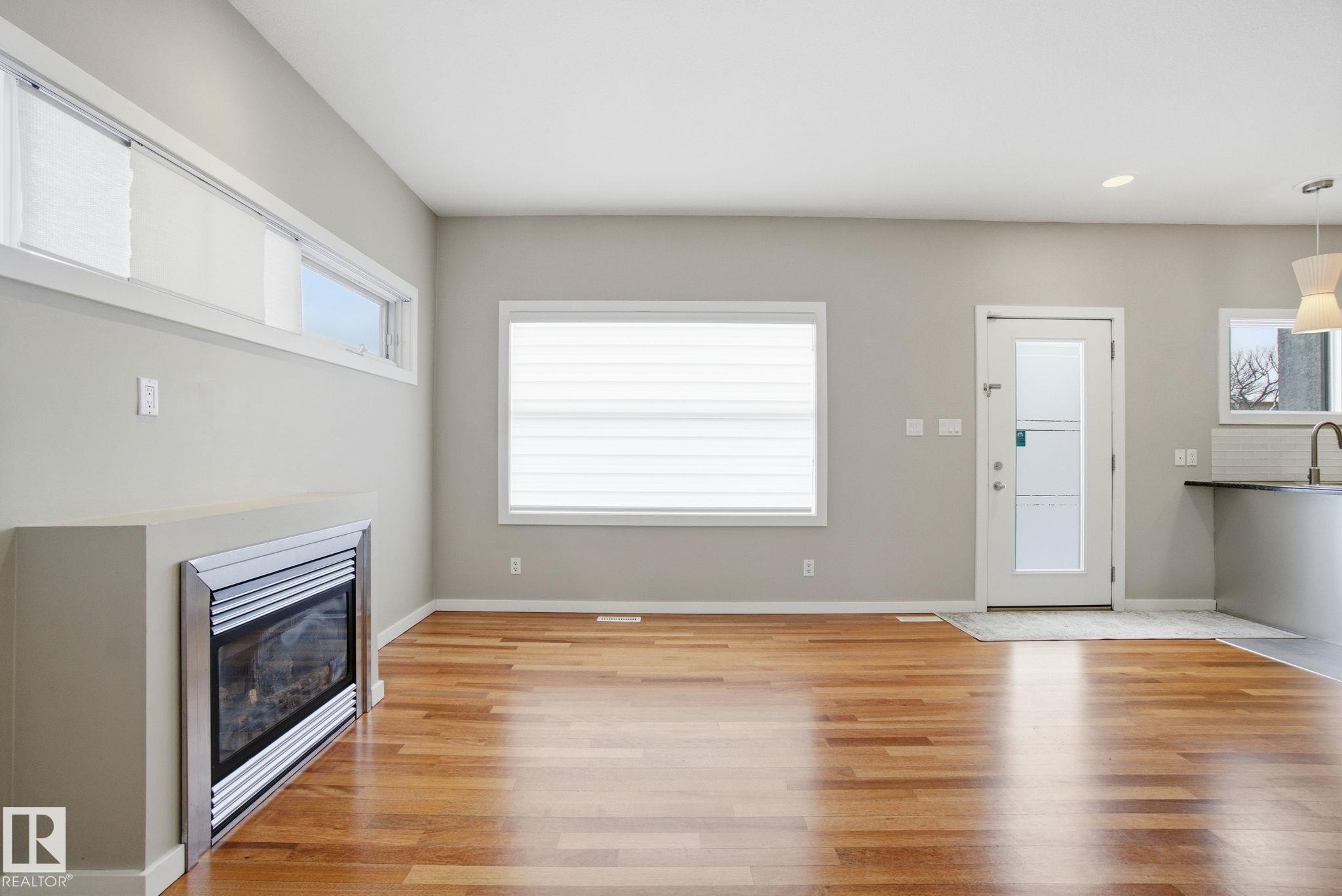4 14315 Stony Plain Road, Edmonton, AB - Indoor With Fireplace