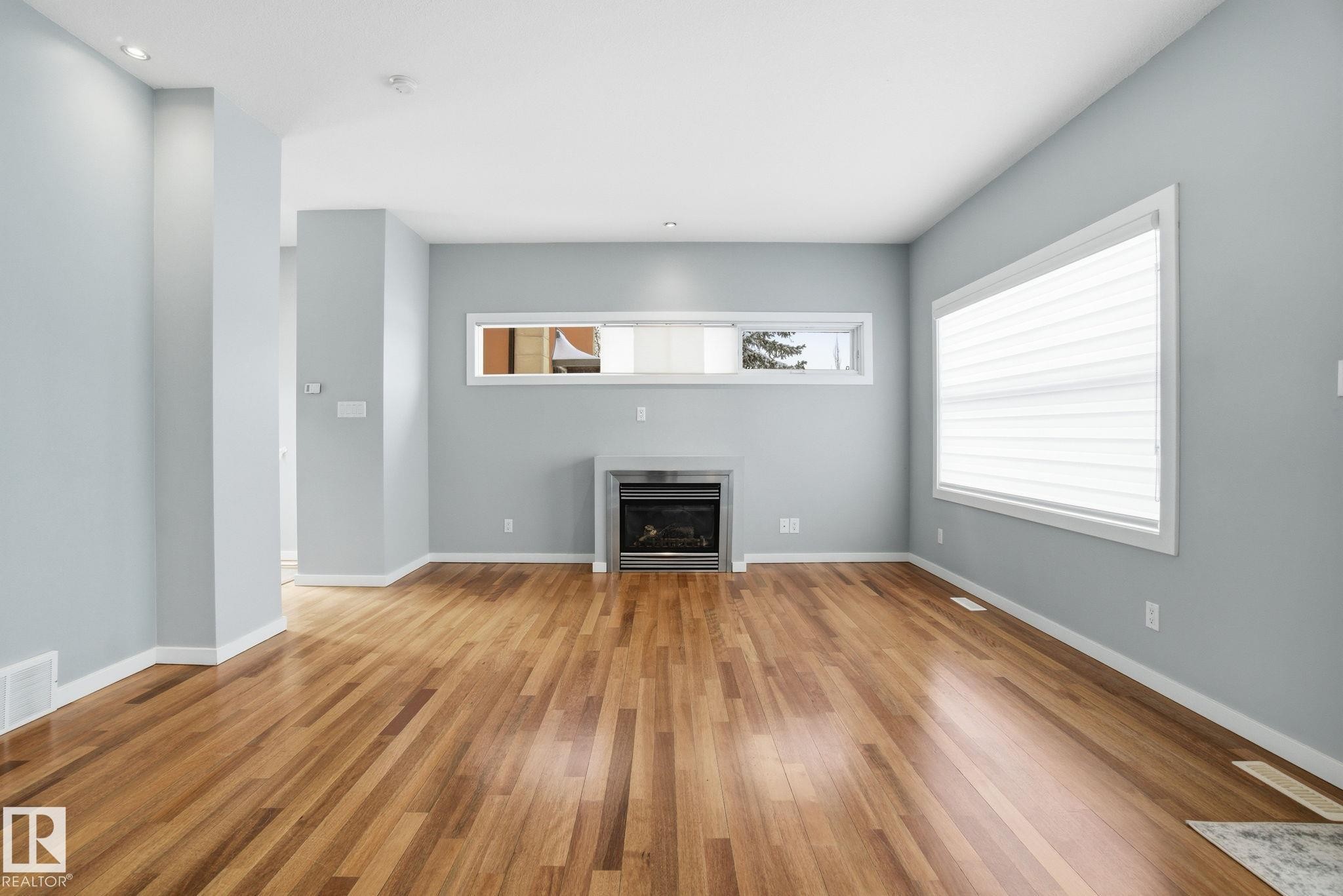 4 14315 Stony Plain Road, Edmonton, AB - Indoor Photo Showing Living Room With Fireplace