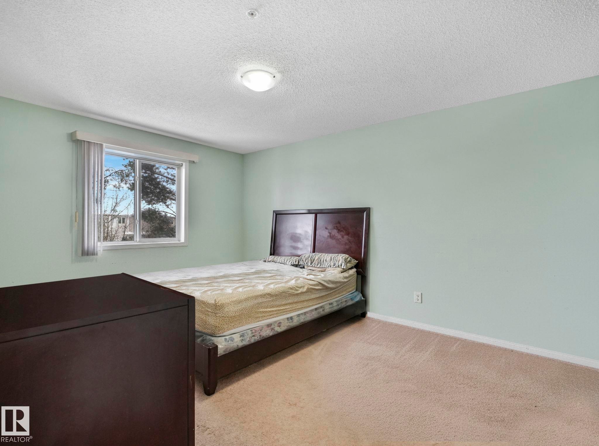 210 245 Edwards Drive, Edmonton, AB - Indoor Photo Showing Bedroom