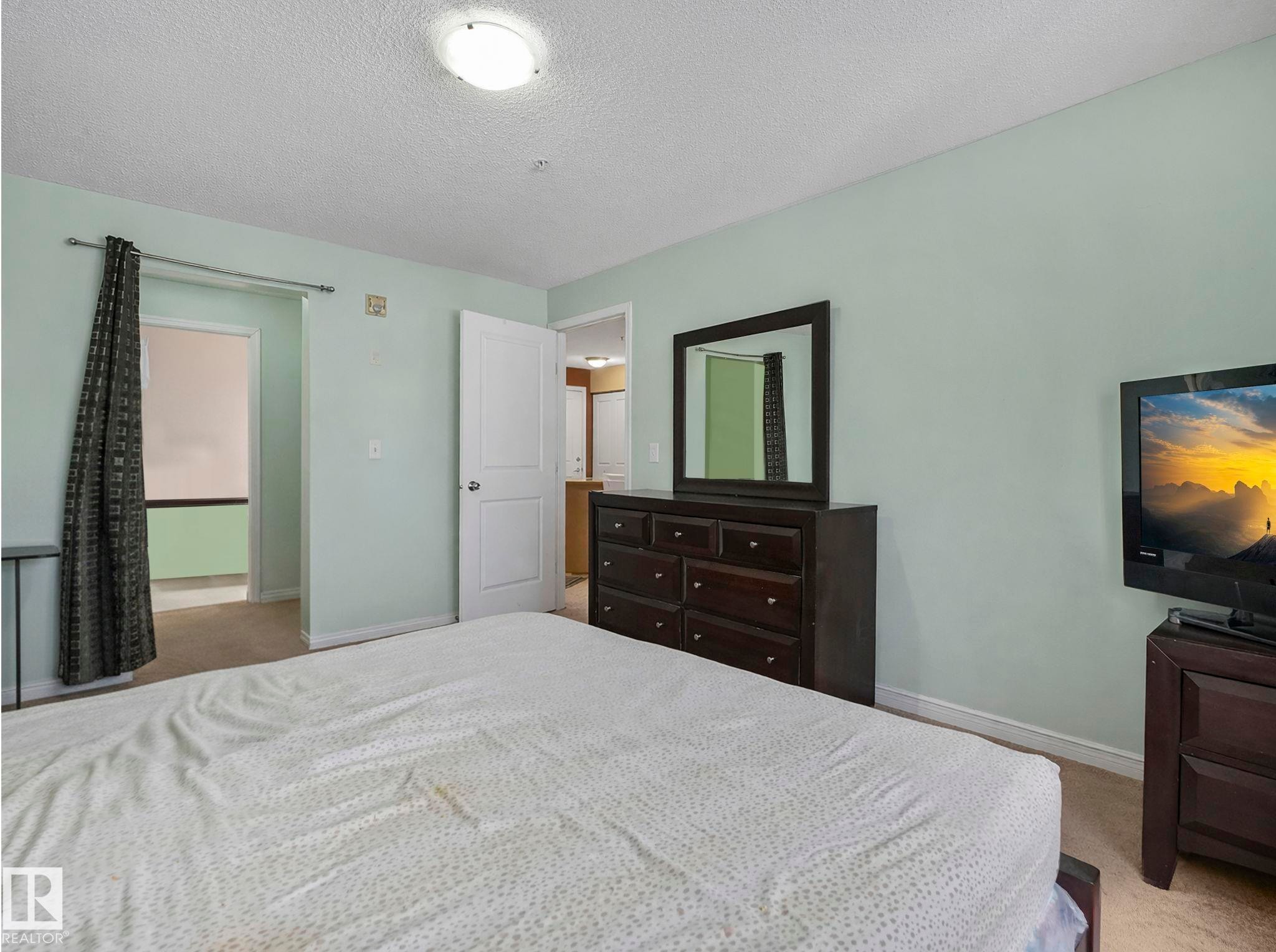 210 245 Edwards Drive, Edmonton, AB - Indoor Photo Showing Bedroom