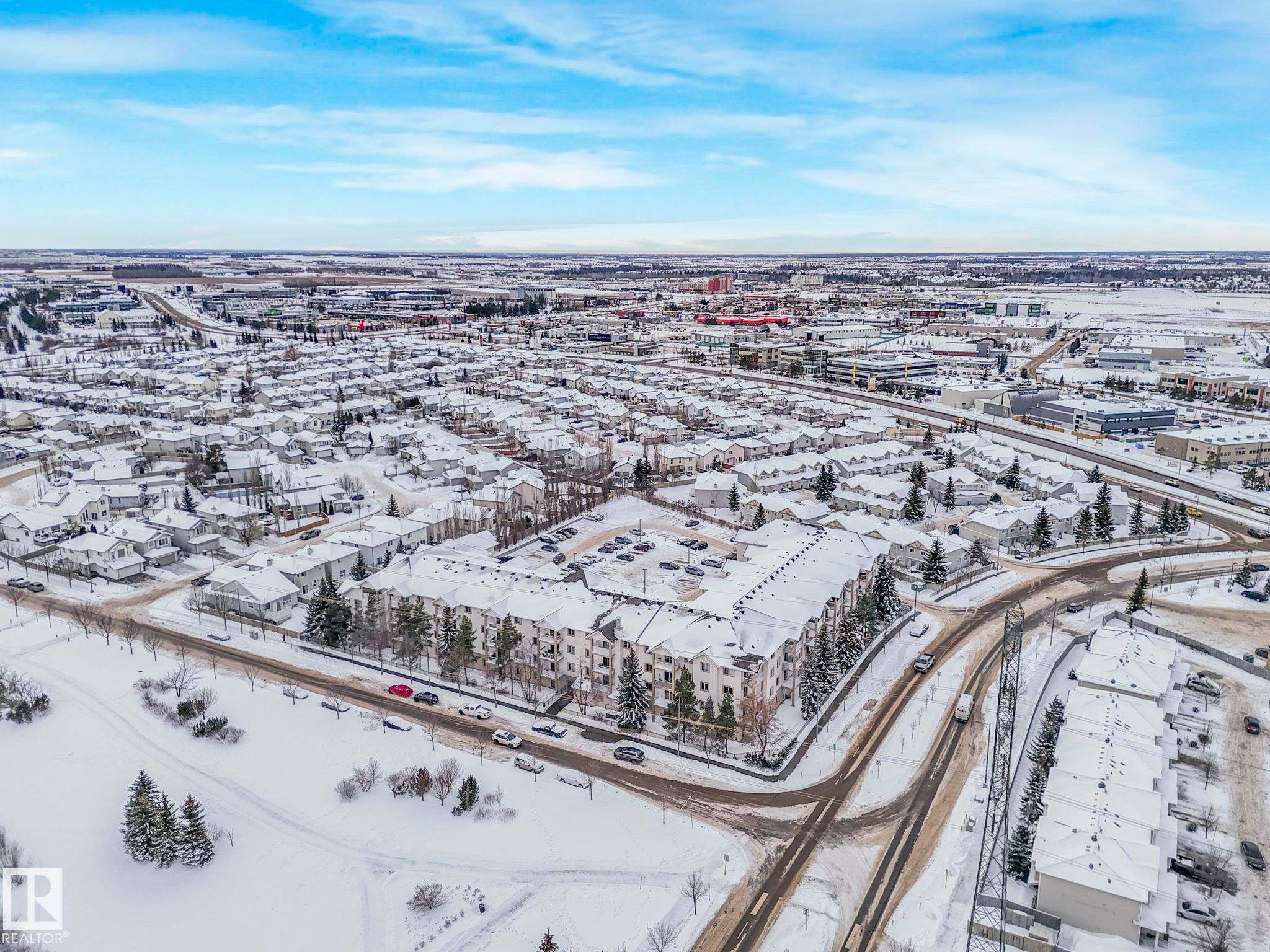 View of snowy aerial view - 210 245 Edwards Drive, Edmonton, AB - Outdoor With View