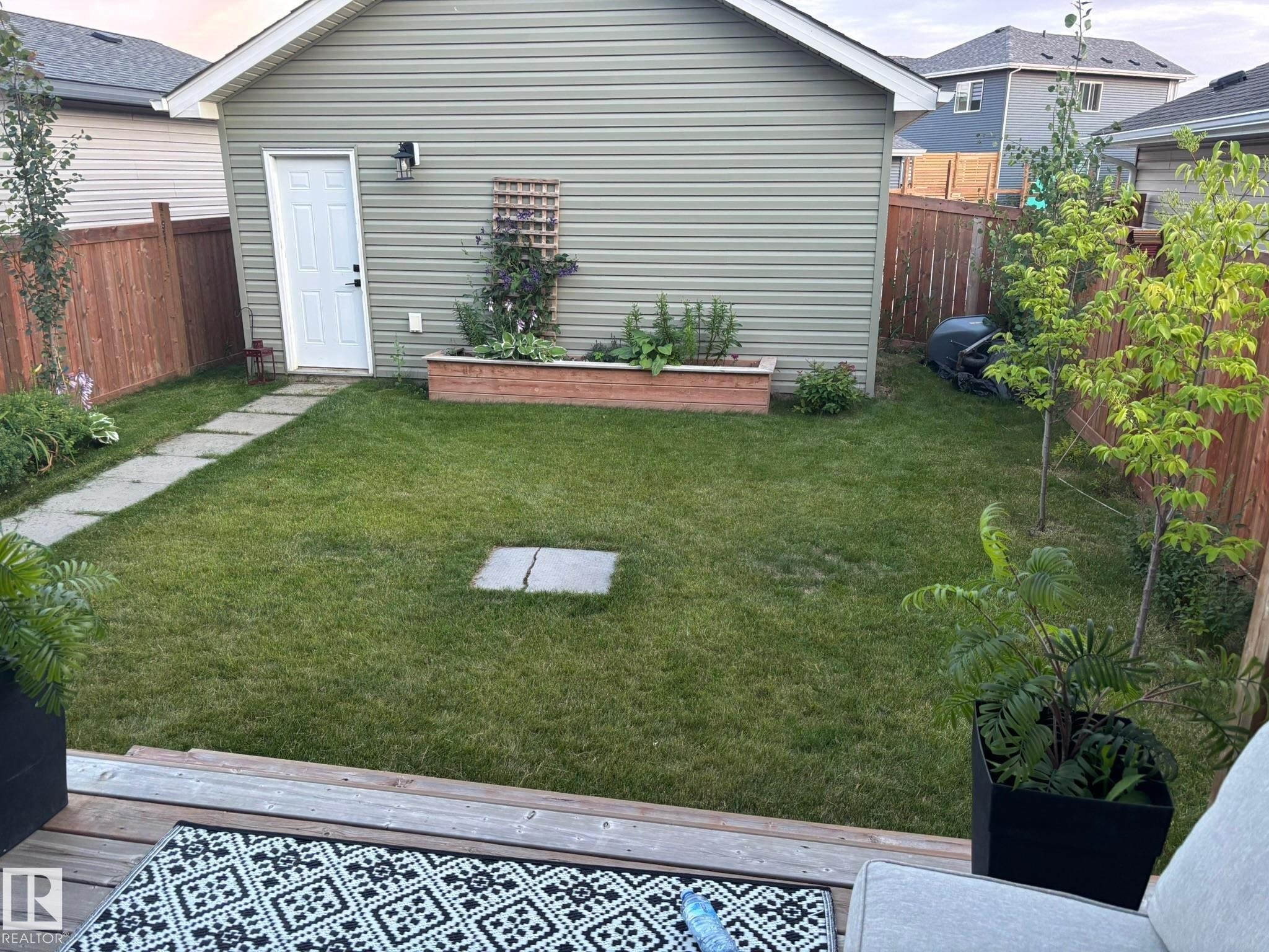 View of fenced backyard - 25 Harrison Gate, Spruce Grove, AB - Outdoor With Exterior