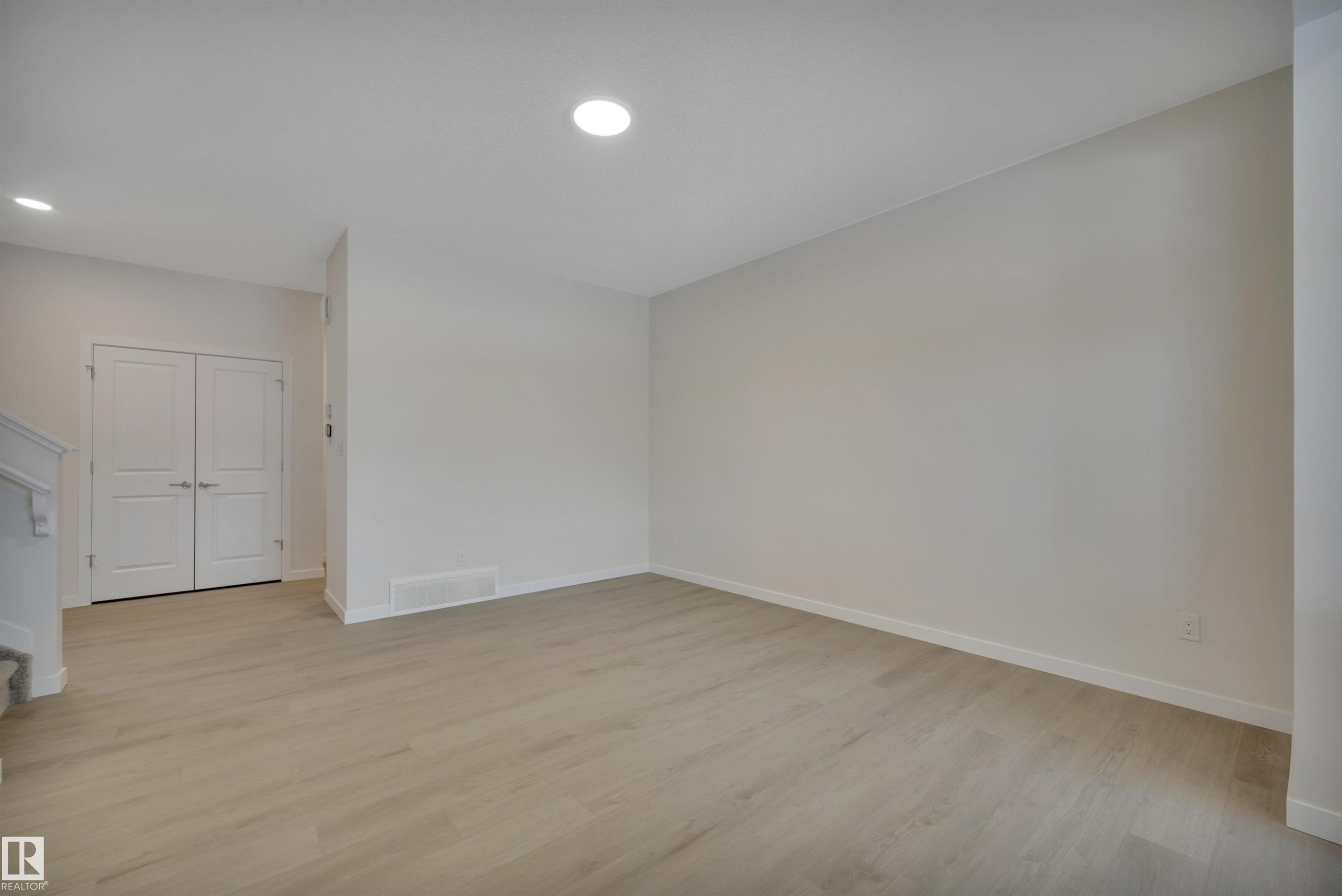 Empty room with light wood finished floors and recessed lighting - 5742 Hawthorn Common, Edmonton, AB - Indoor Photo Showing Other Room