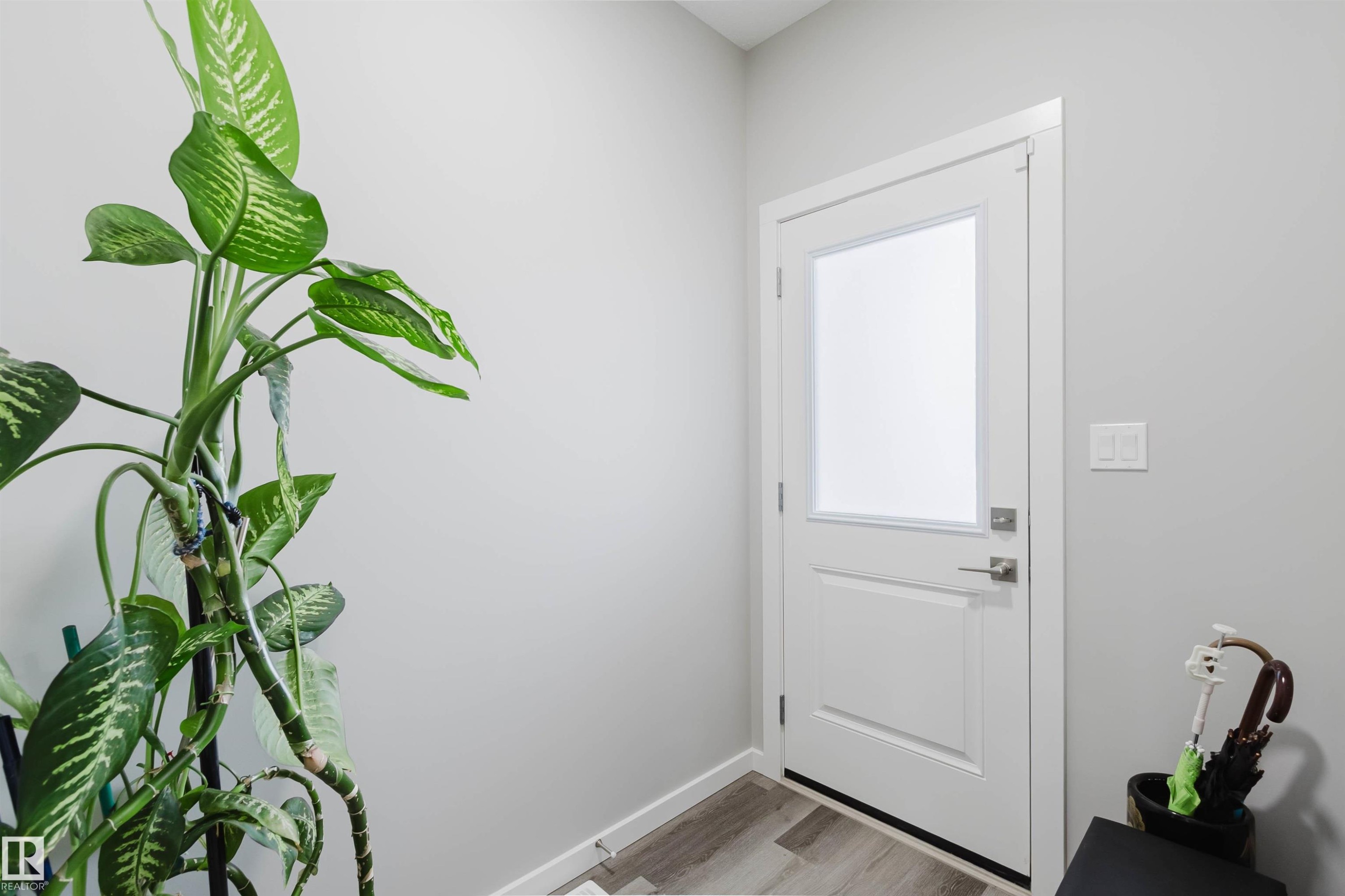 Doorway to outside featuring wood finished floors and baseboards - 343 Edgemont Drive, Edmonton, AB - Indoor Photo Showing Other Room