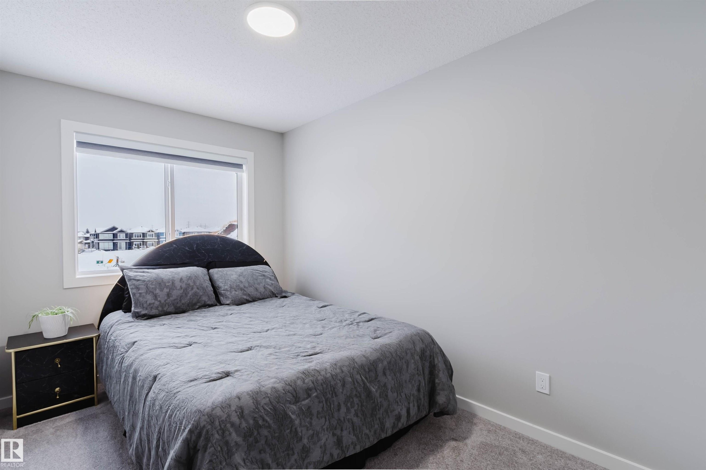 Carpeted bedroom with baseboards - 343 Edgemont Drive, Edmonton, AB - Indoor Photo Showing Bedroom