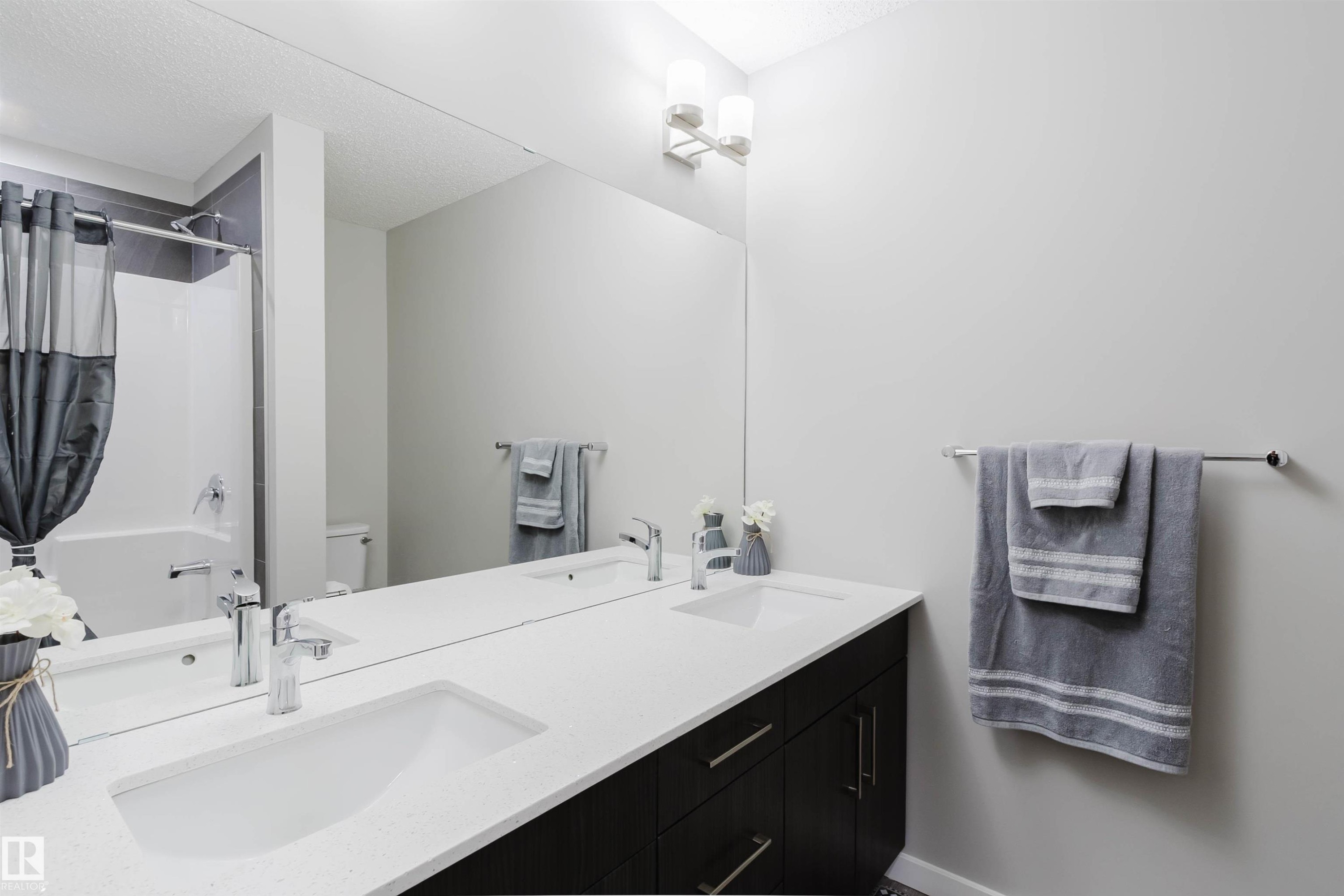 Full bathroom featuring double vanity and shower / bath combo - 343 Edgemont Drive, Edmonton, AB - Indoor Photo Showing Bathroom