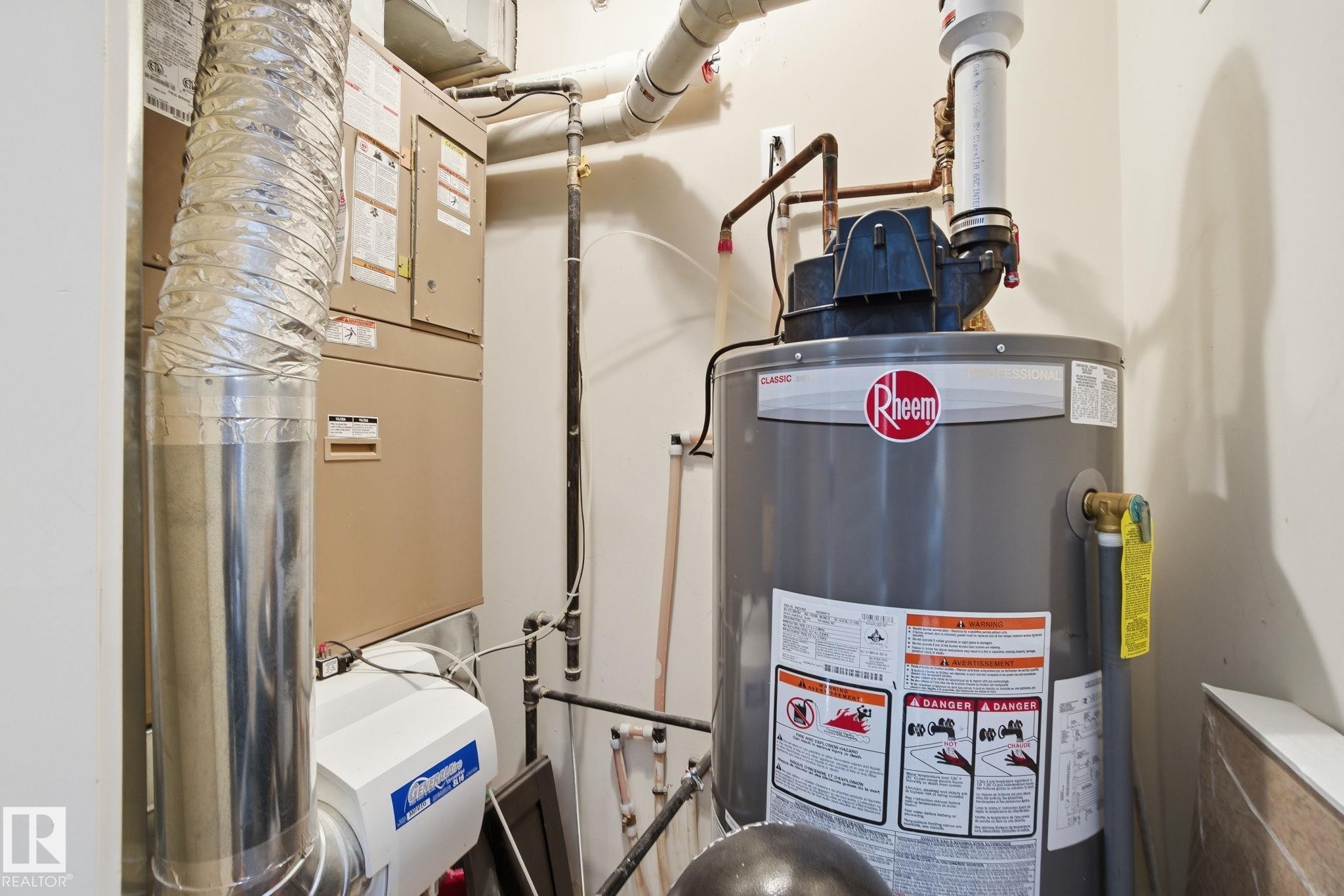 Utilities with water heater and heating unit - 301 9603 98 Avenue, Edmonton, AB - Indoor