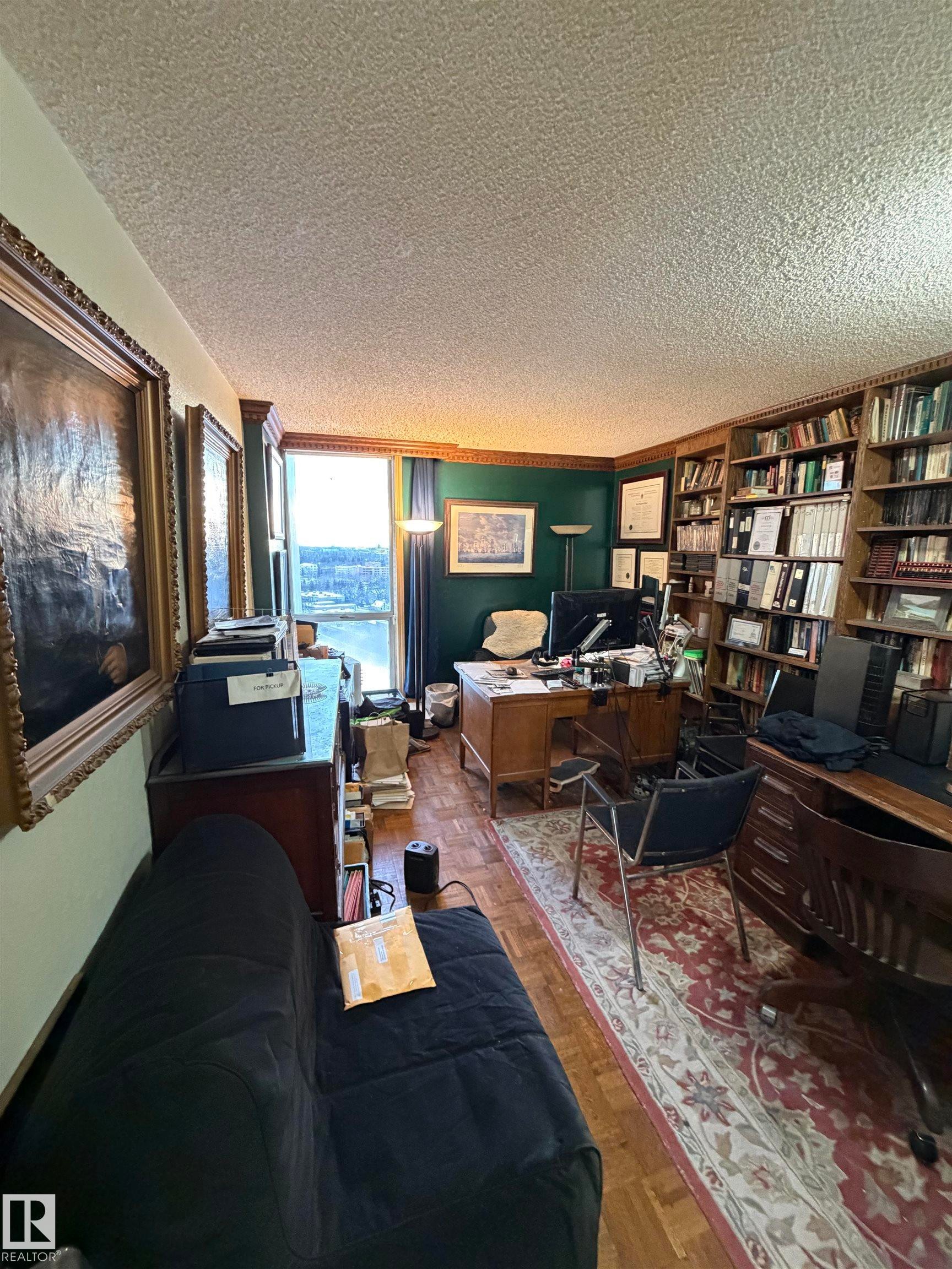 Office area with a textured ceiling - 1506 10883 Saskatchewan Dr, Edmonton, AB - Indoor