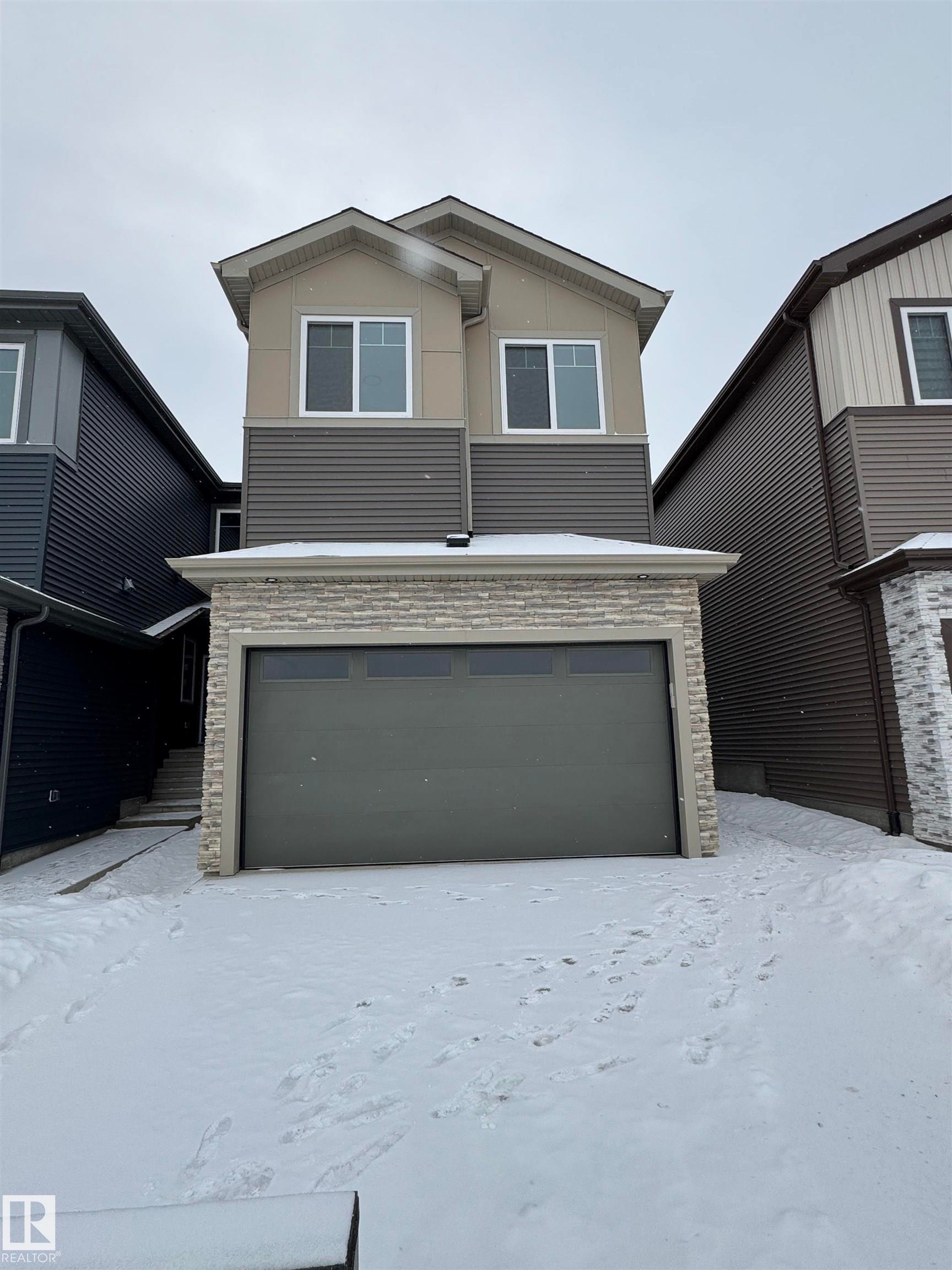 Modern home with stone siding and a garage - 22835 80 Avenue, Edmonton, AB - Outdoor