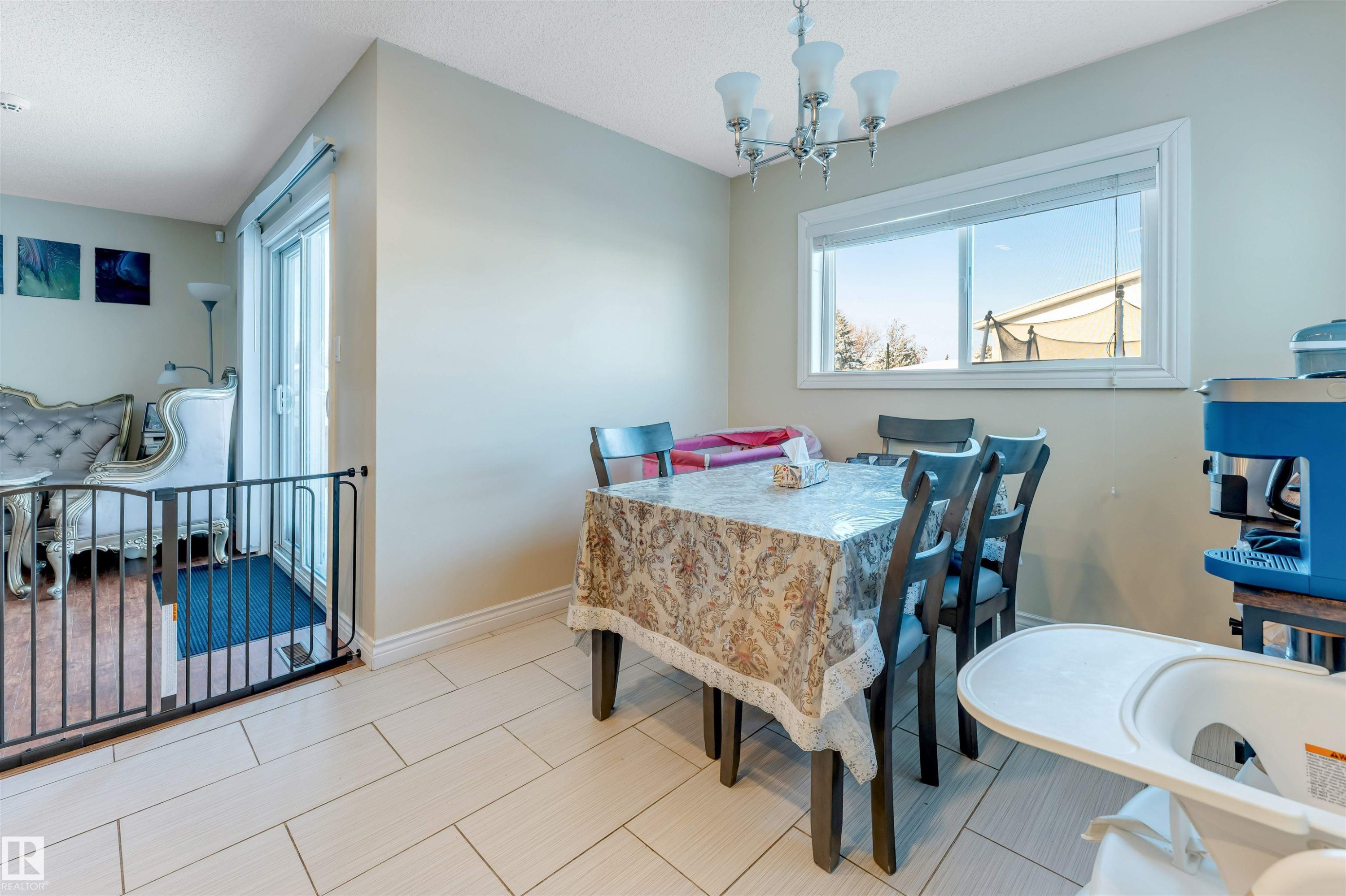 Dining space with a chandelier and a textured ceiling - 18404 97A Avenue, Edmonton, AB - Indoor Photo Showing Dining Room
