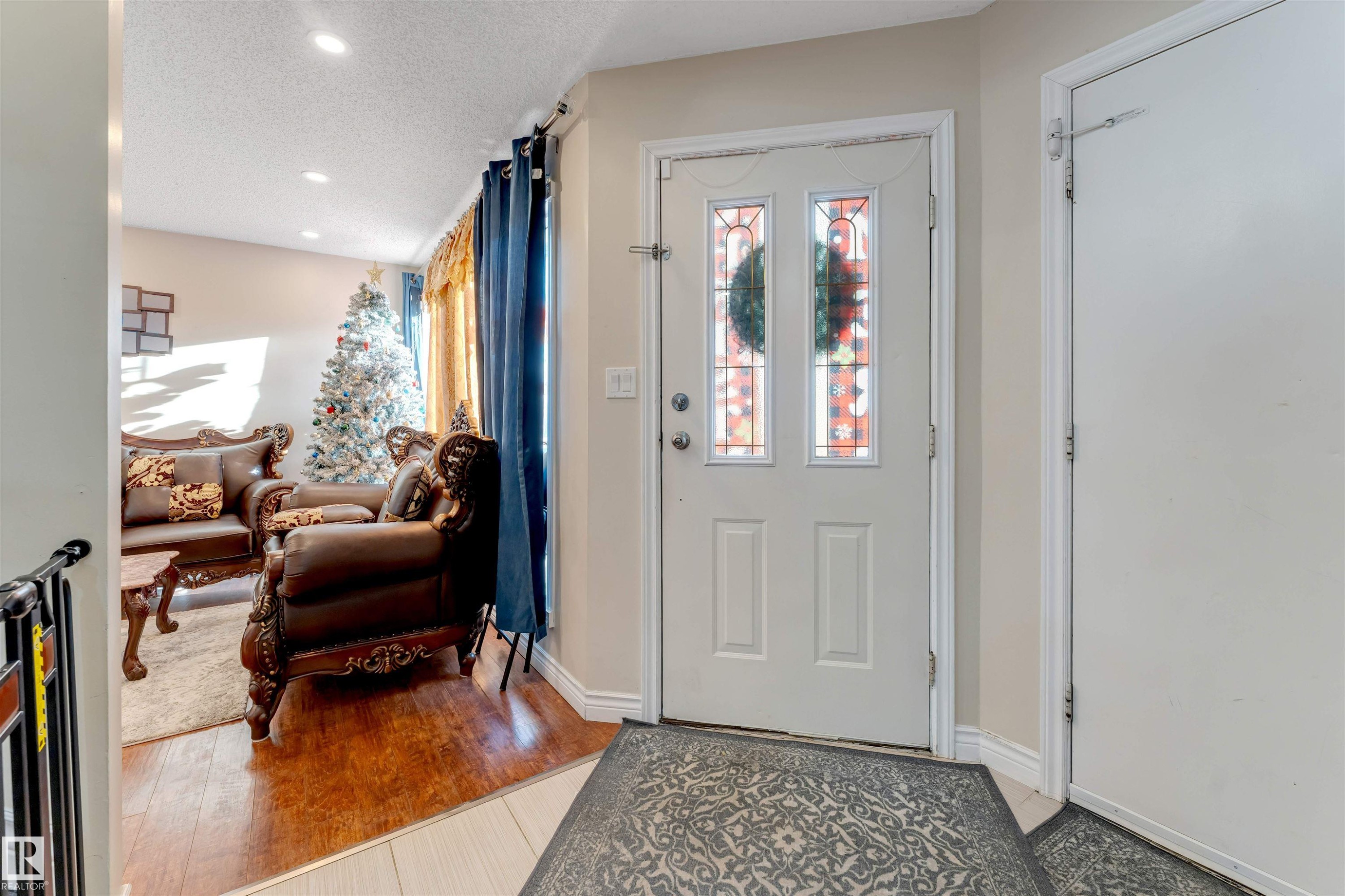 Entrance foyer featuring light wood finished floors, a textured ceiling, and recessed lighting - 18404 97A Avenue, Edmonton, AB - Indoor Photo Showing Other Room