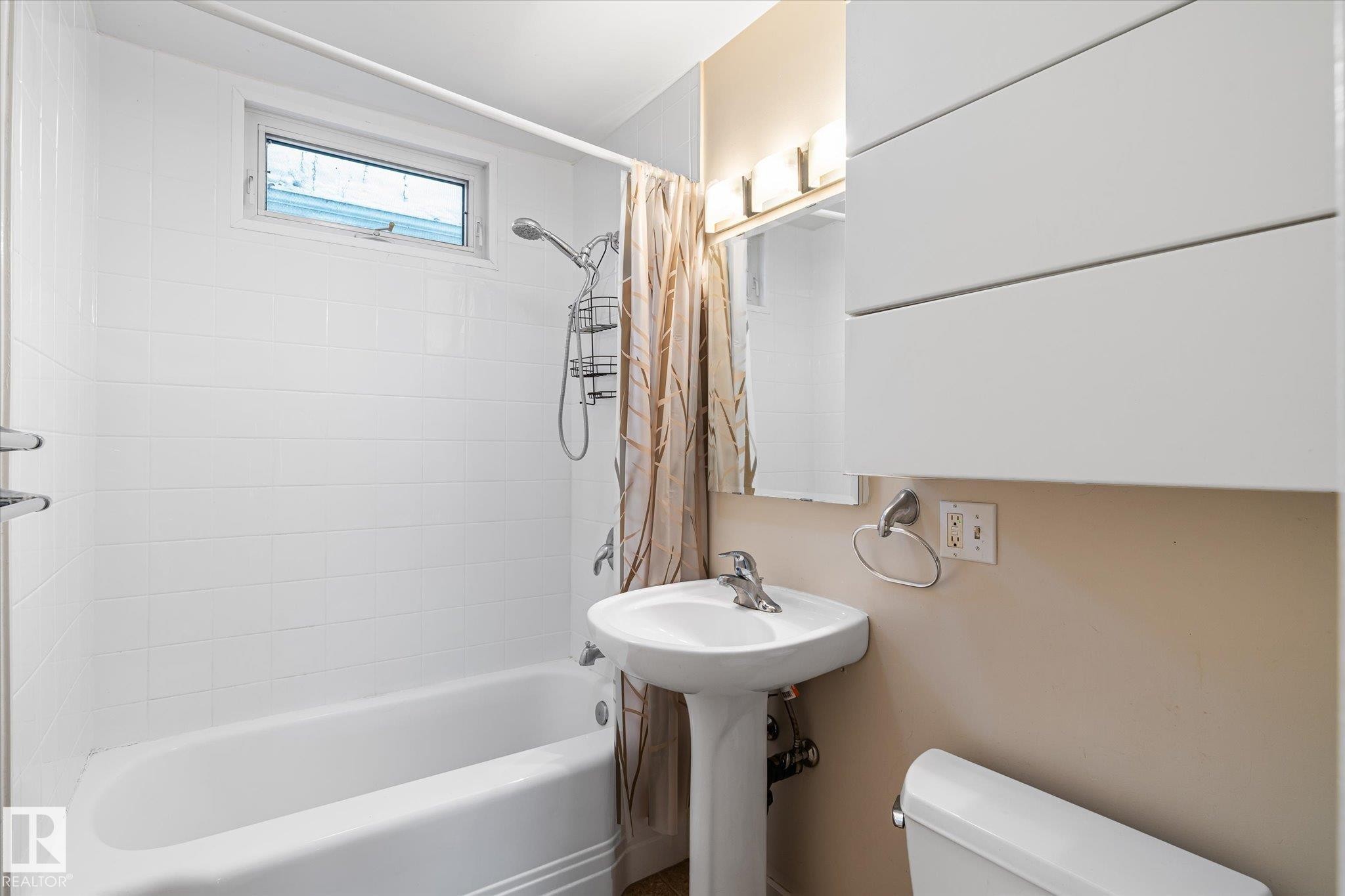 Bathroom with shower / bathtub combination with curtain and toilet - 10429 143 Street, Edmonton, AB - Indoor Photo Showing Bathroom