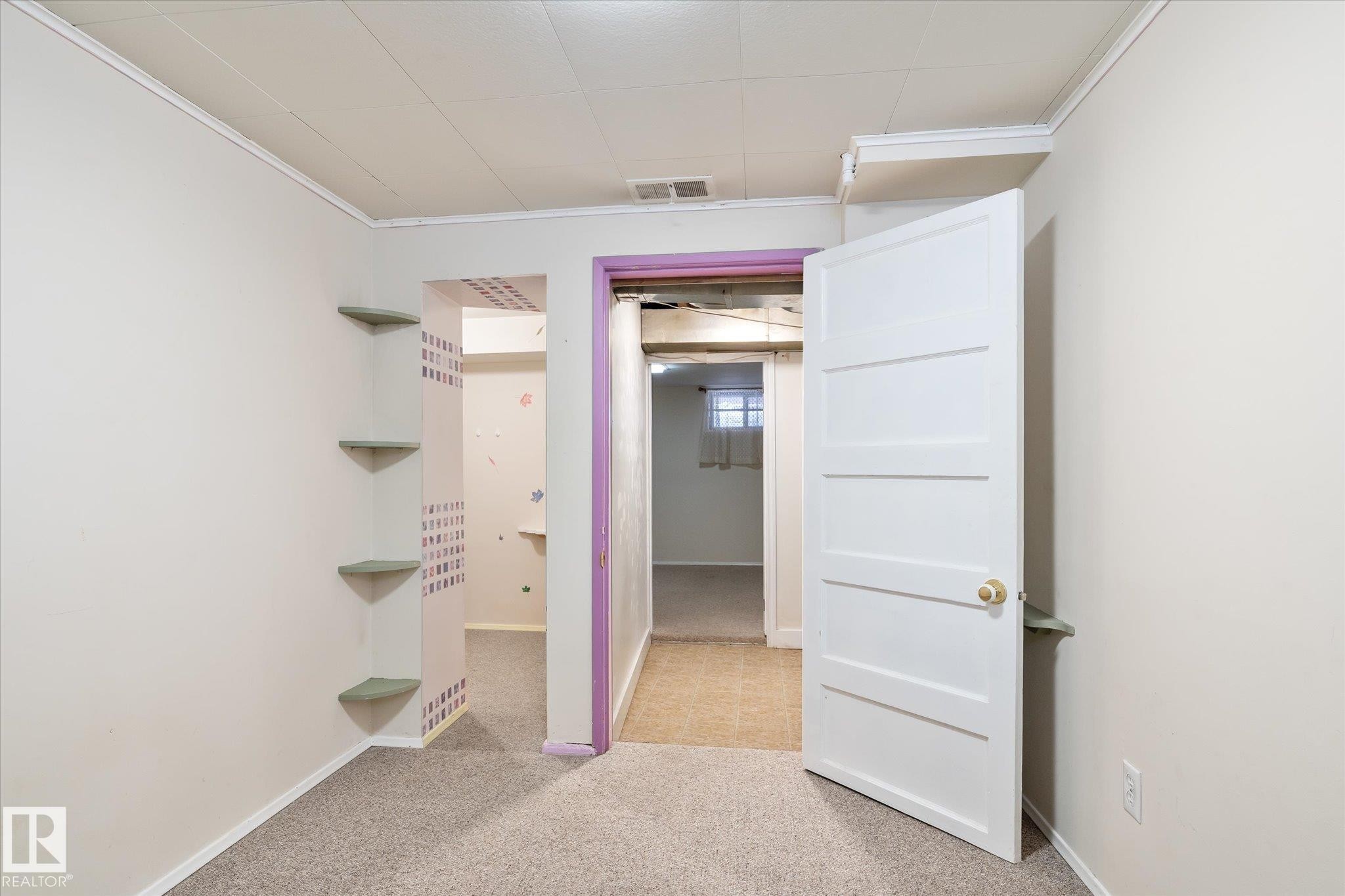 Unfurnished bedroom featuring light colored carpet and ornamental molding - 10429 143 Street, Edmonton, AB - Indoor Photo Showing Other Room