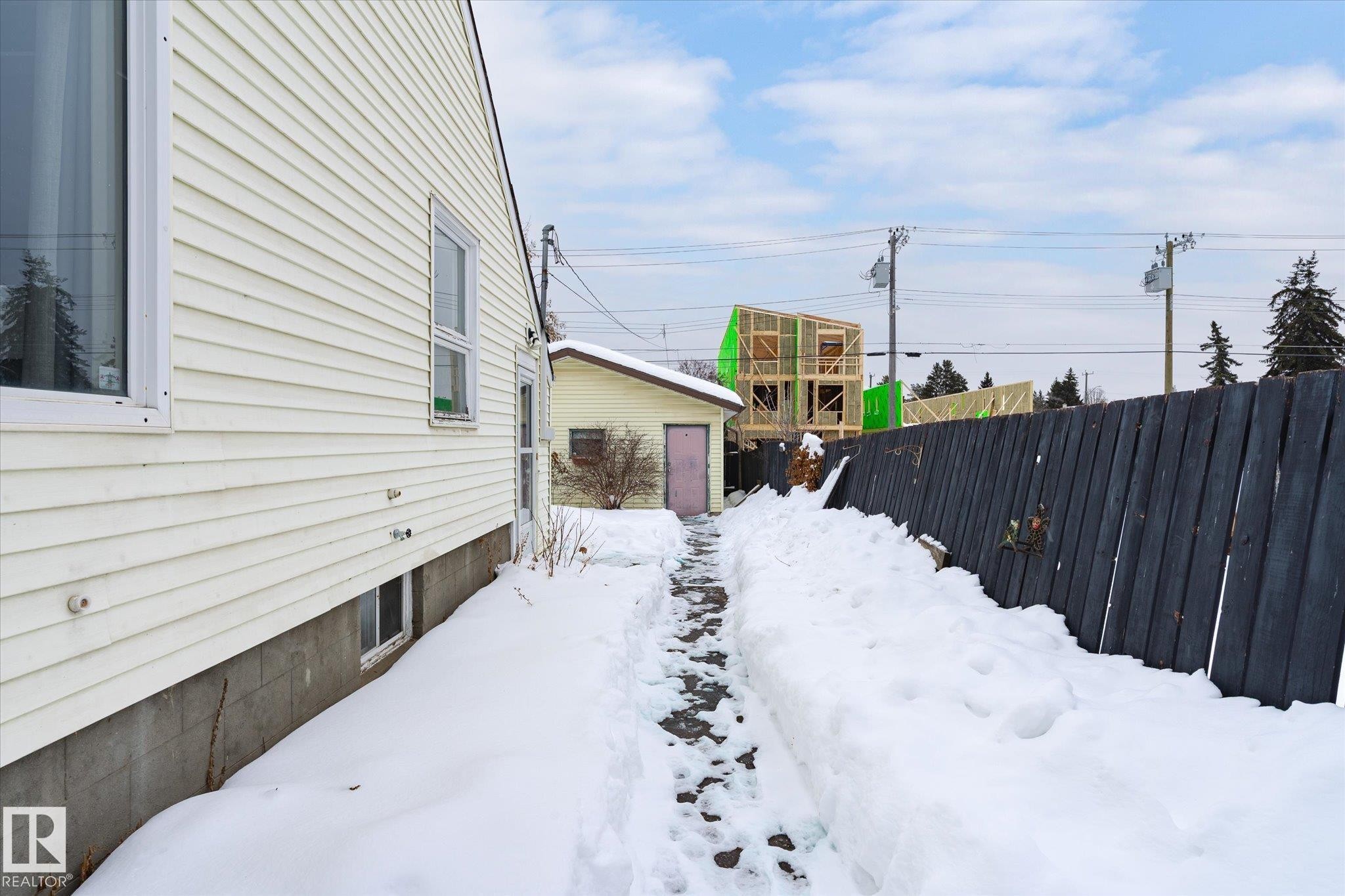View of yard layered in snow - 10429 143 Street, Edmonton, AB - Outdoor With Exterior