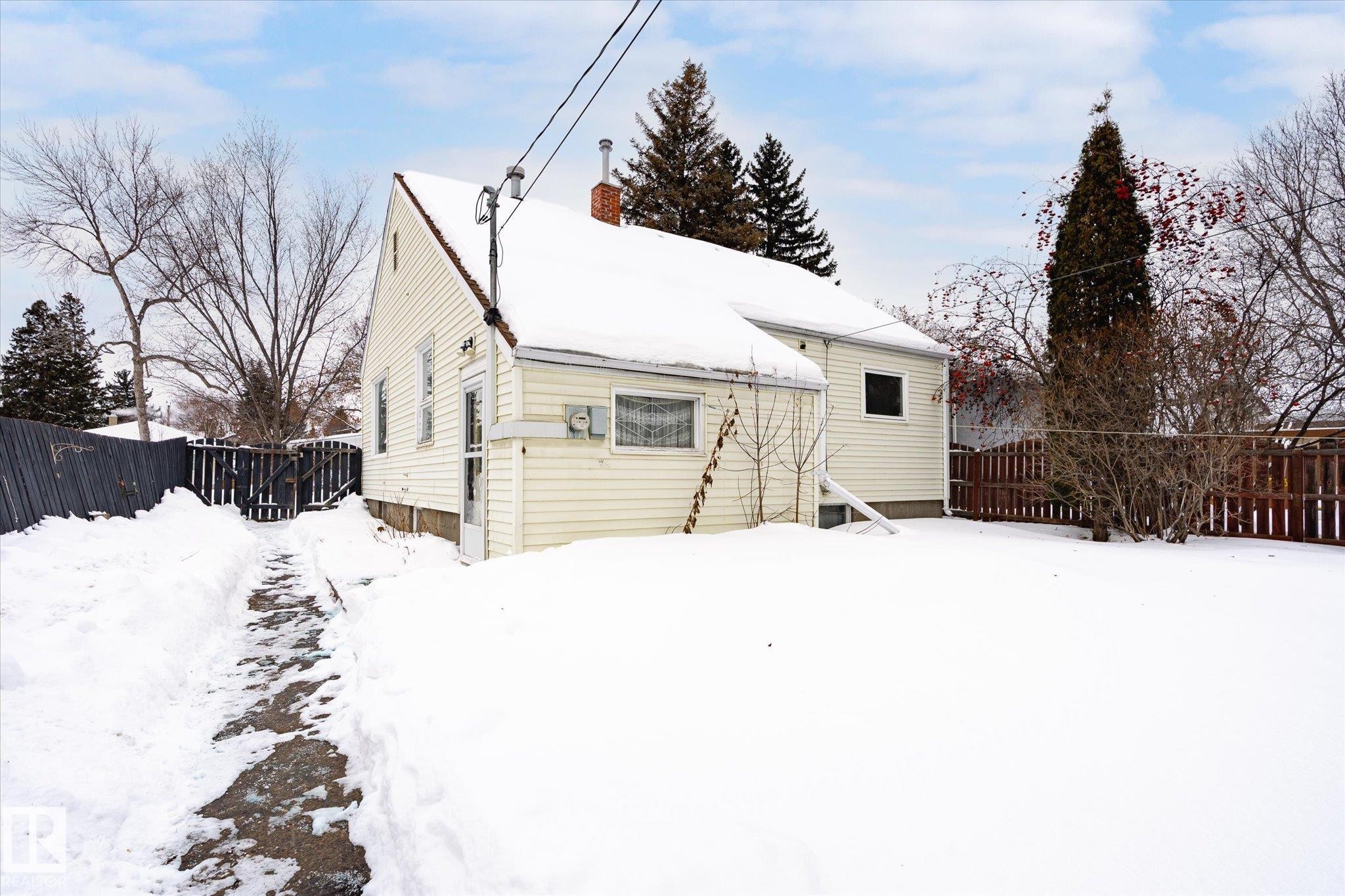 Snow covered property with a chimney - 10429 143 Street, Edmonton, AB - Outdoor