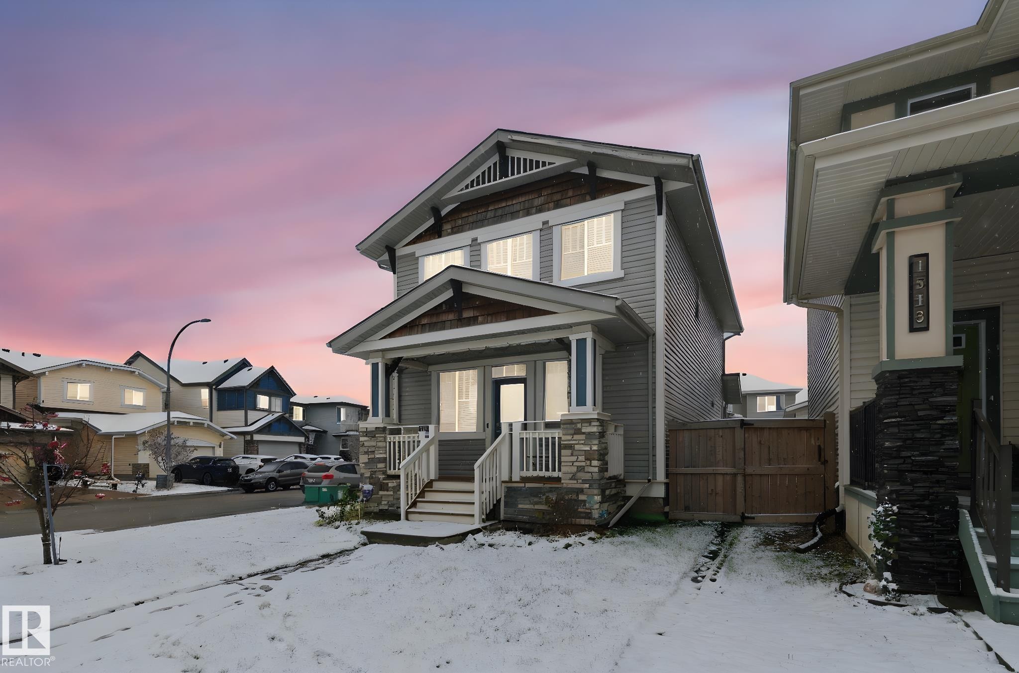 View of front facade with a gate and a porch - 1511 Secord Rd, Edmonton, AB - Outdoor