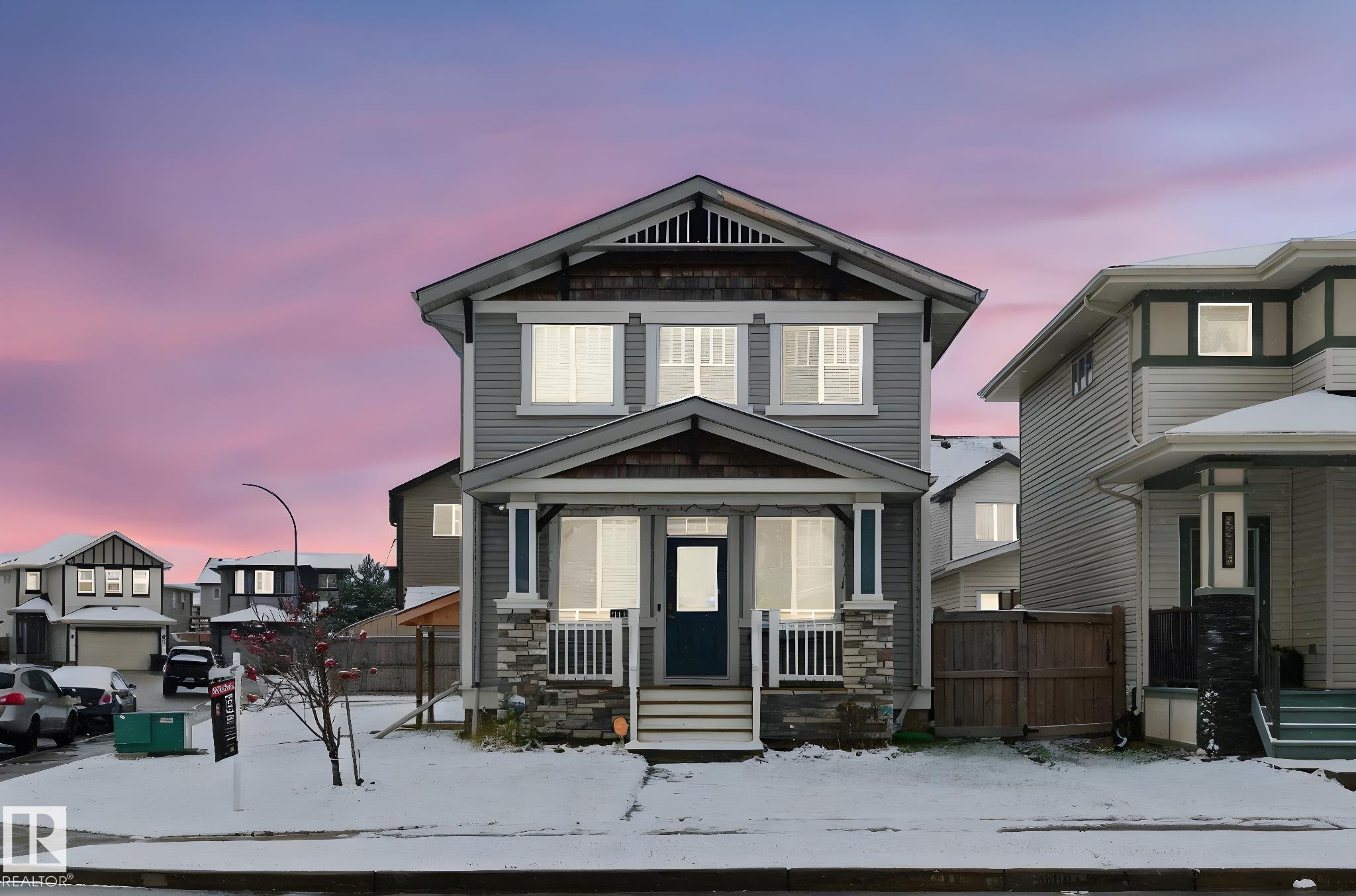 View of front of house featuring stone siding - 1511 Secord Rd, Edmonton, AB - Outdoor With Facade