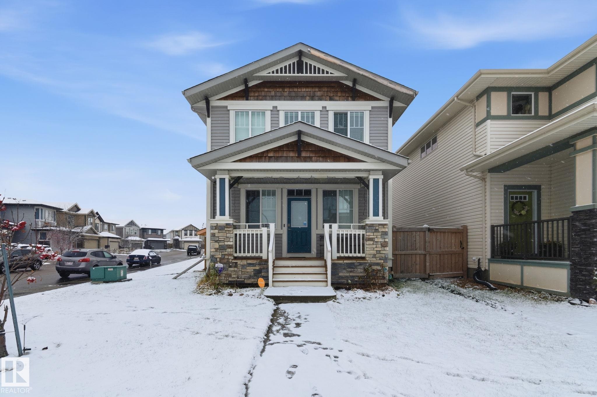 View of front of property with covered porch and stone siding - 1511 Secord Rd, Edmonton, AB - Outdoor