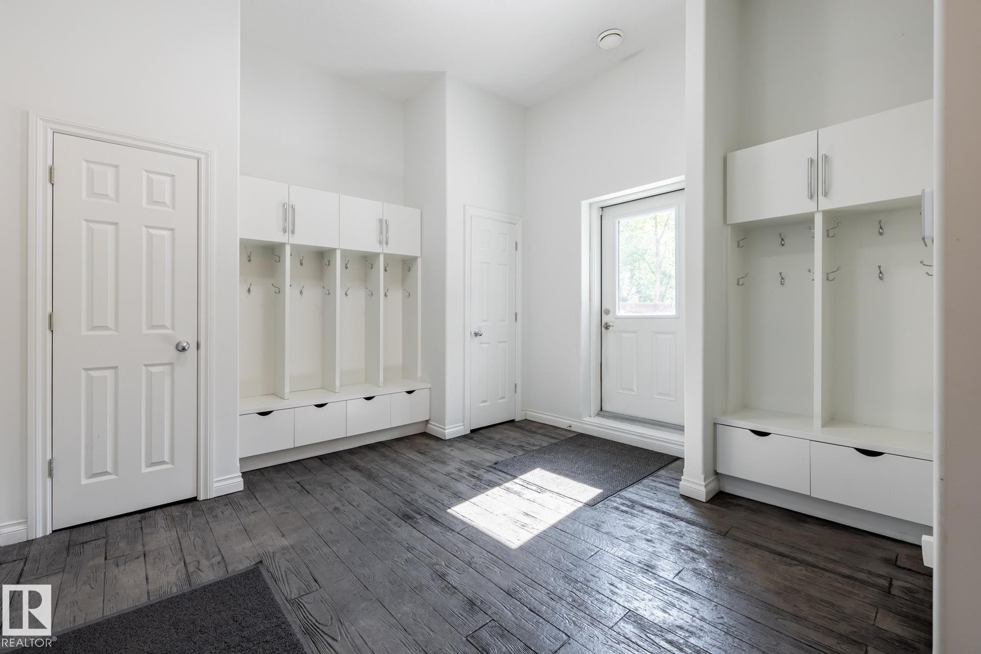 Mudroom featuring a high ceiling and dark wood-type flooring - 12428 103 Avenue Nw, Edmonton, AB - Indoor Photo Showing Other Room