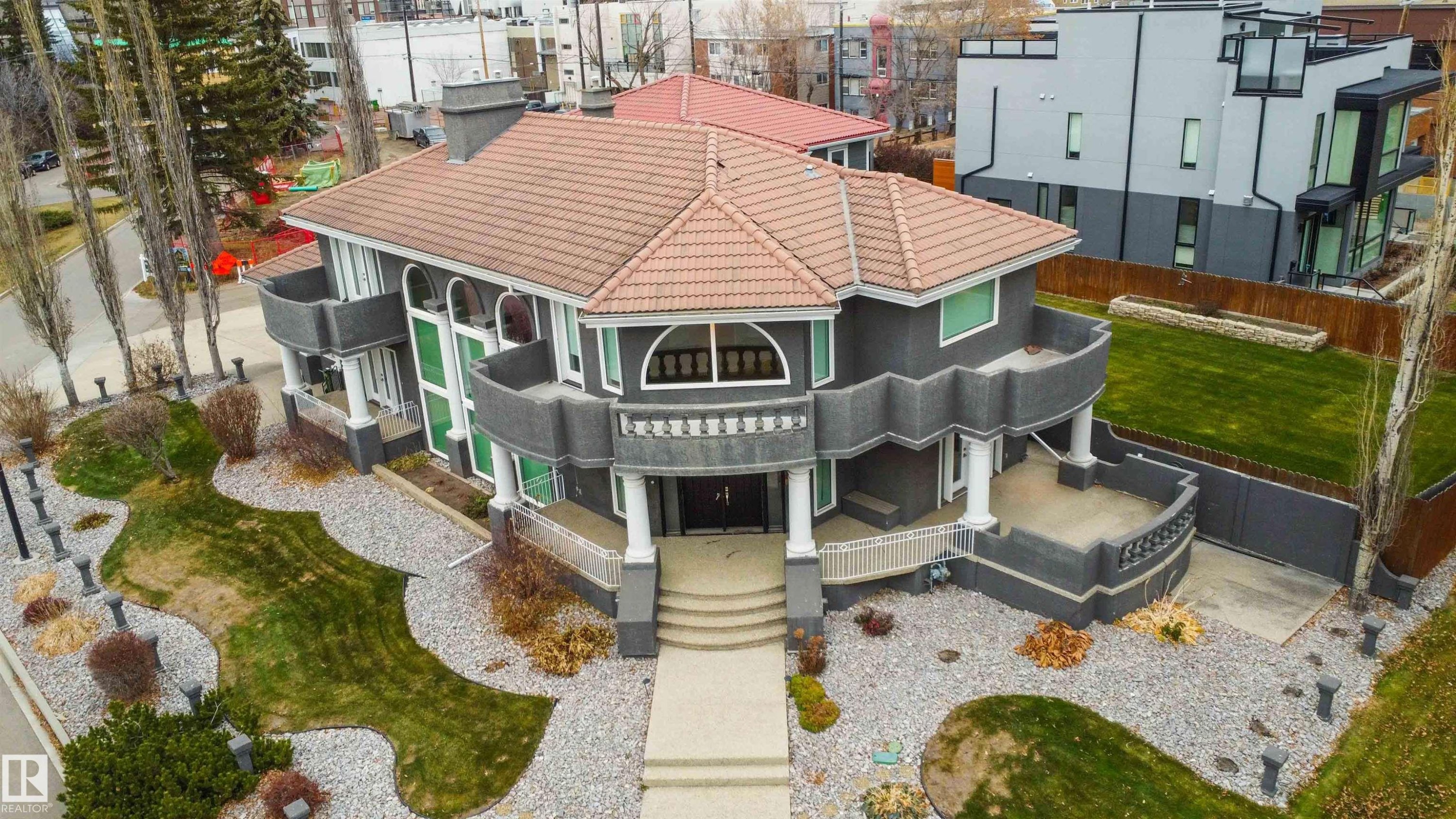 View of front facade featuring a tile roof and stucco siding - 12428 103 Avenue Nw, Edmonton, AB - Outdoor With Facade