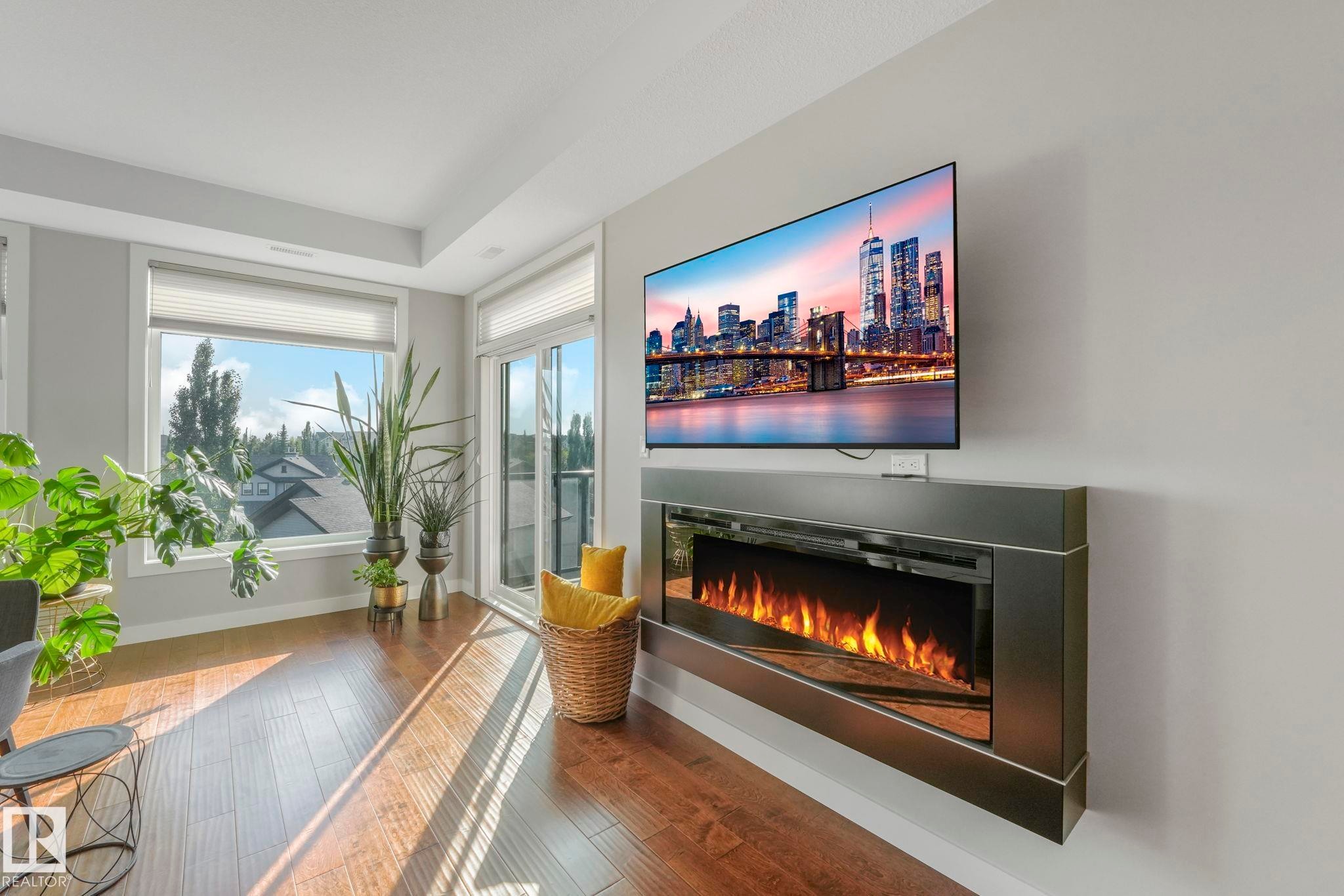 409 625 Leger Way, Edmonton, AB - Indoor Photo Showing Other Room With Fireplace