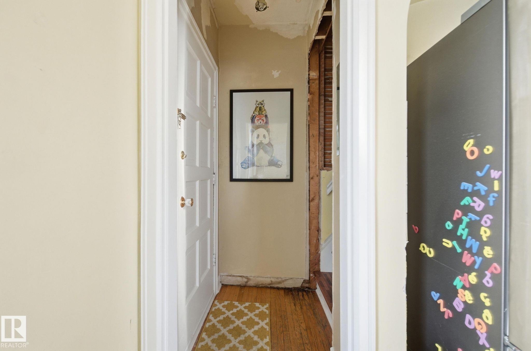 Hallway with hardwood / wood-style flooring - 11515 101 Street, Edmonton, AB - Indoor Photo Showing Other Room