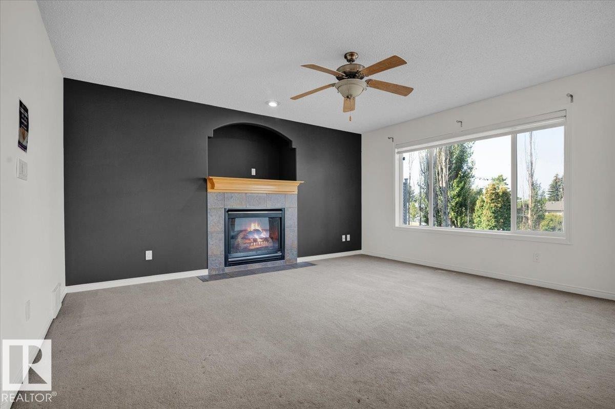 4074 33A Street, Edmonton, AB - Indoor Photo Showing Living Room With Fireplace