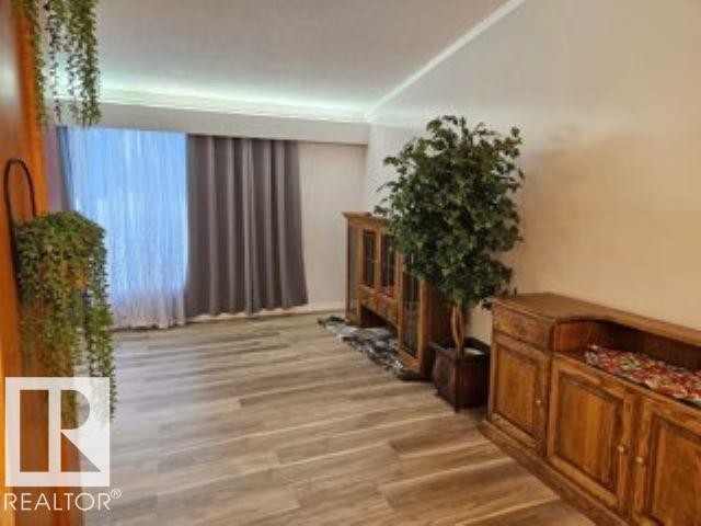 Hallway with light wood-style floors - 4910 53 Avenue, Willingdon, AB