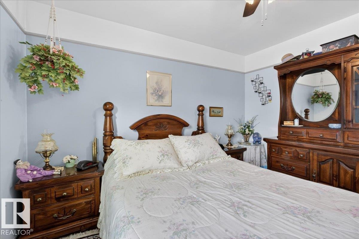 Bedroom featuring a ceiling fan - 11630 71 Street, Edmonton, AB - Indoor Photo Showing Bedroom