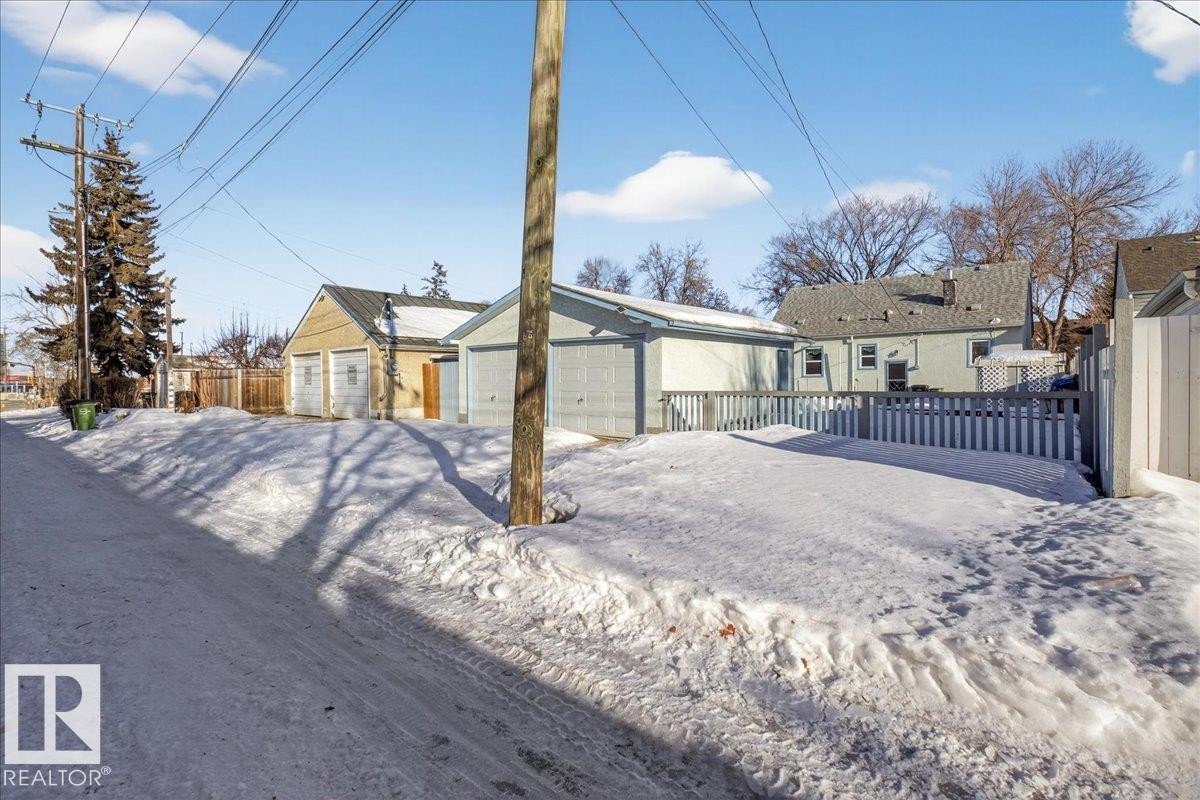 View of back of property with a garage - 11630 71 Street, Edmonton, AB - Outdoor