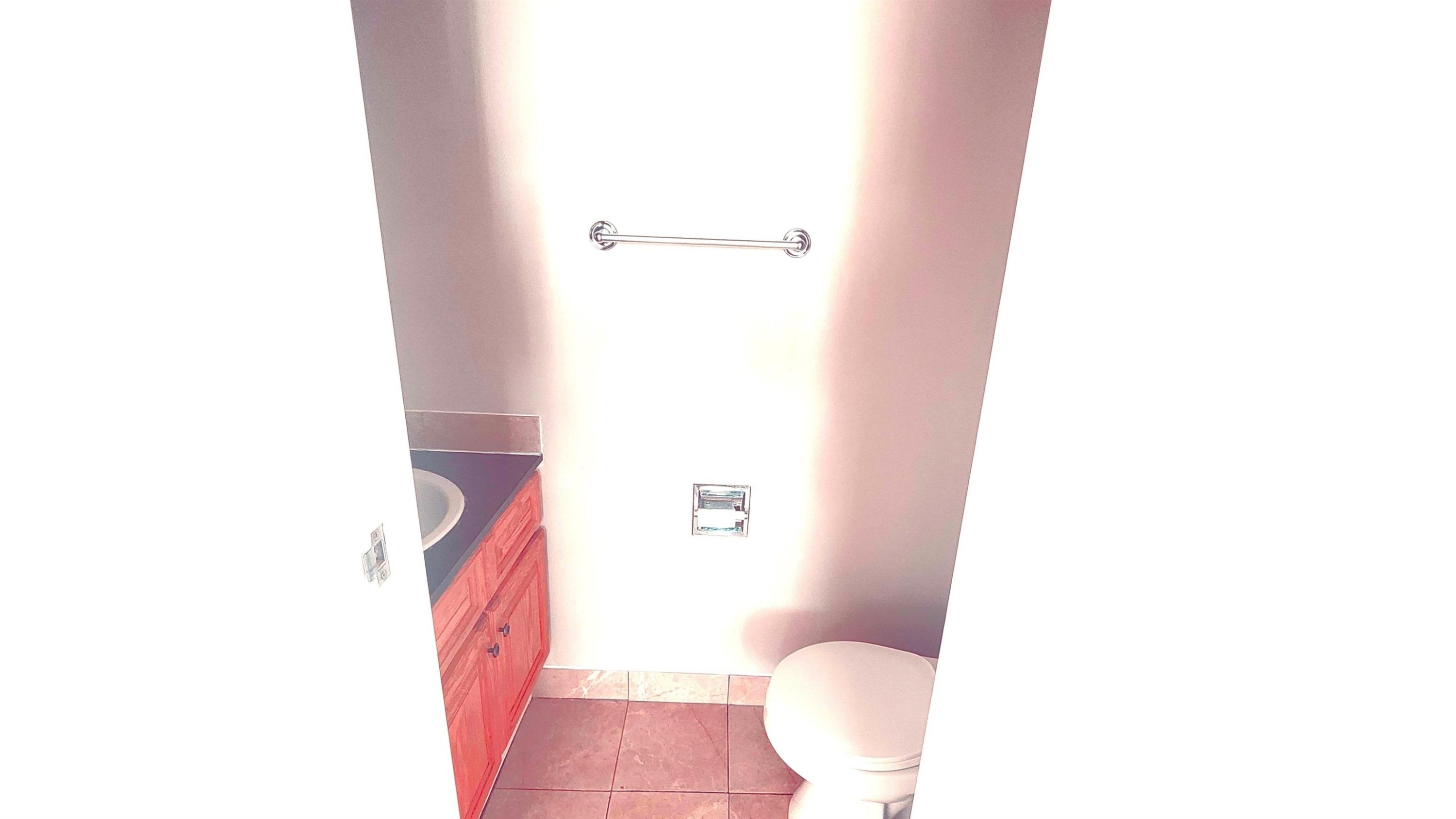 Bathroom with vanity and dark tile patterned floors - 2 11265 31 Avenue, Edmonton, AB - Indoor Photo Showing Bathroom