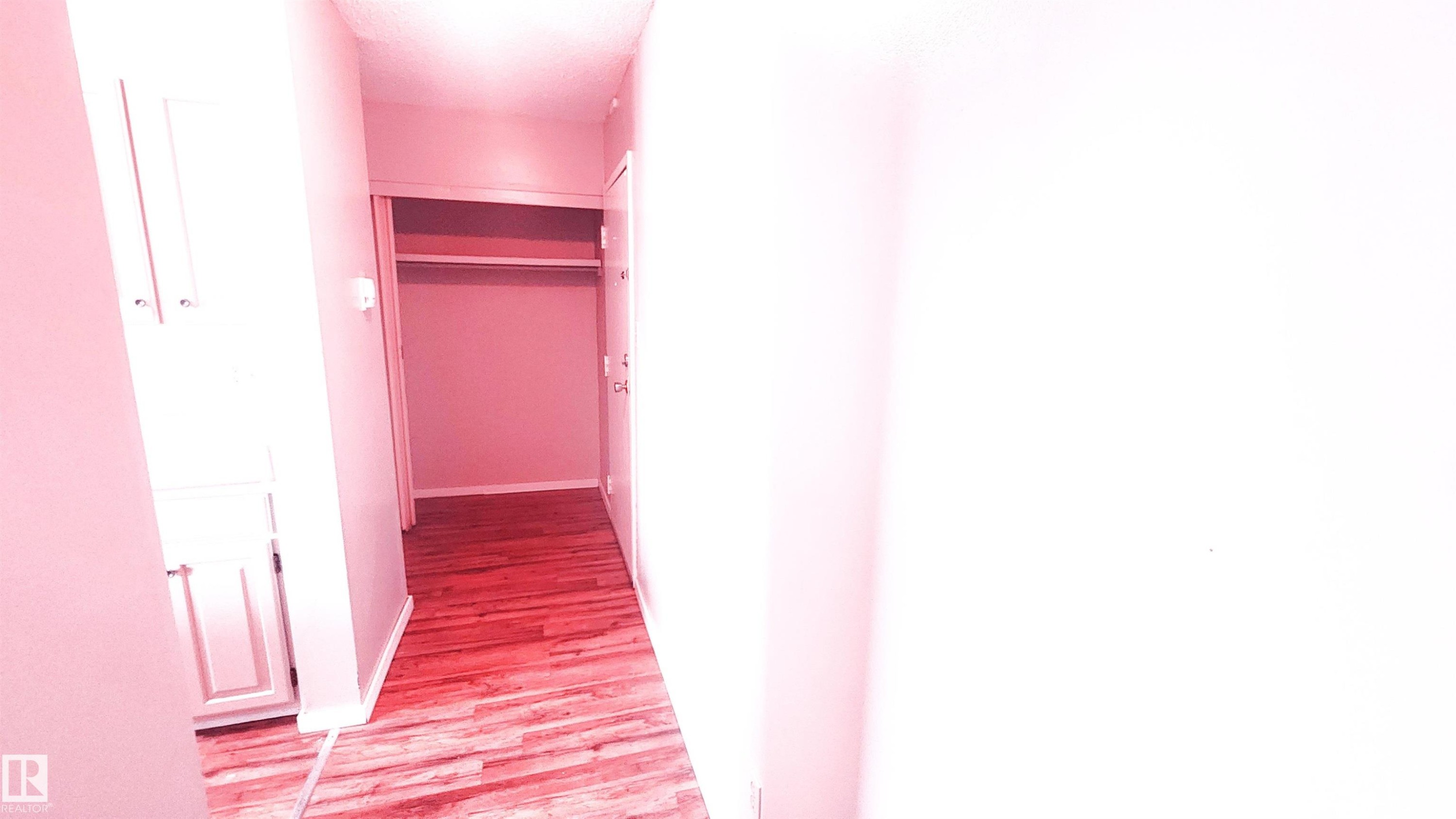 Hall featuring baseboards and light wood finished floors - 2 11265 31 Avenue, Edmonton, AB - Photo Showing Other Room