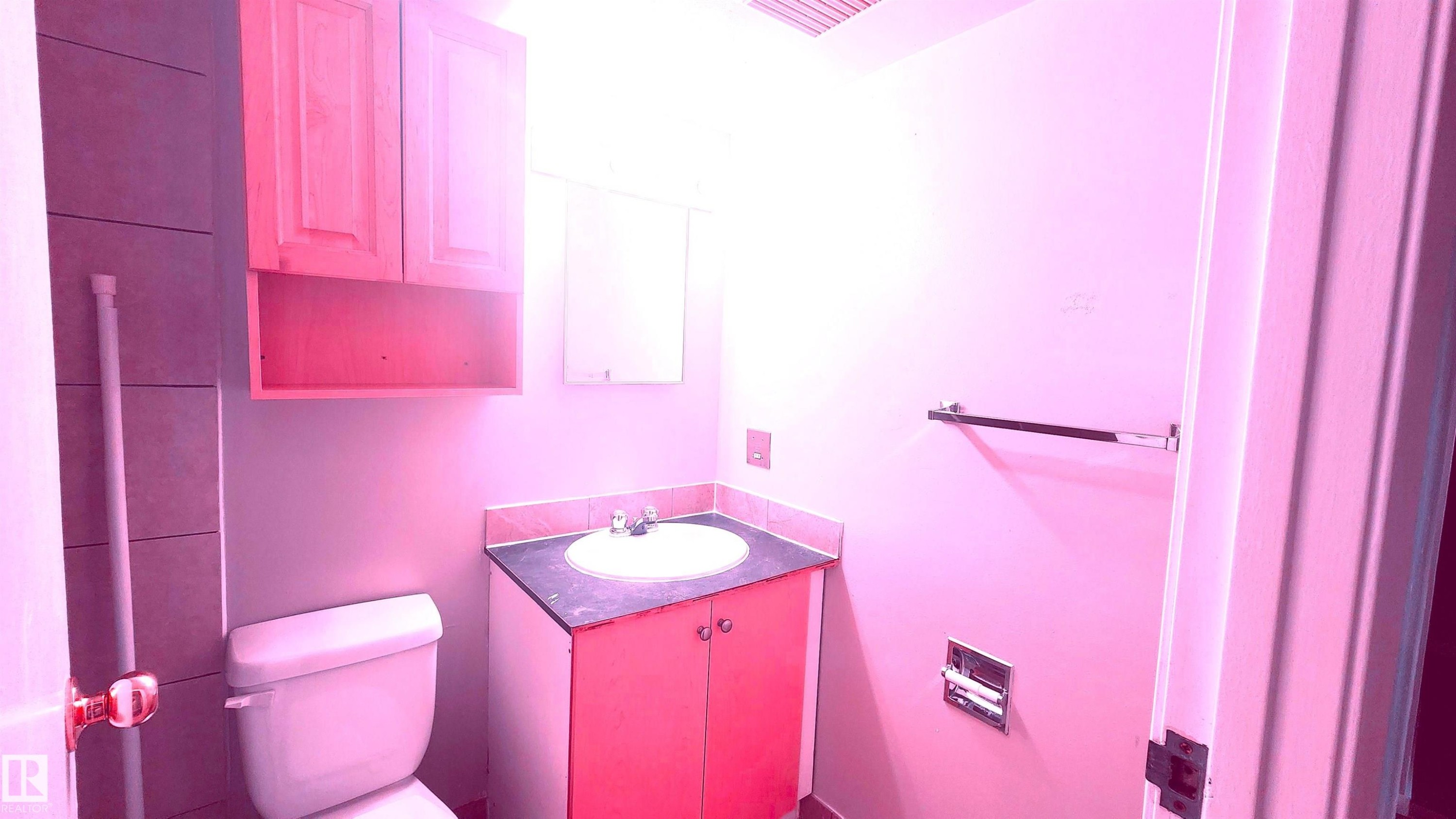 Half bathroom featuring vanity and toilet - 2 11265 31 Avenue, Edmonton, AB - Indoor Photo Showing Bathroom