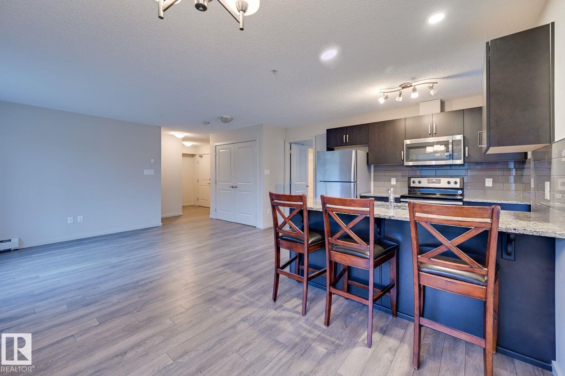 101 142 Ebbers Boulevard, Edmonton, AB - Indoor Photo Showing Kitchen With Stainless Steel Kitchen