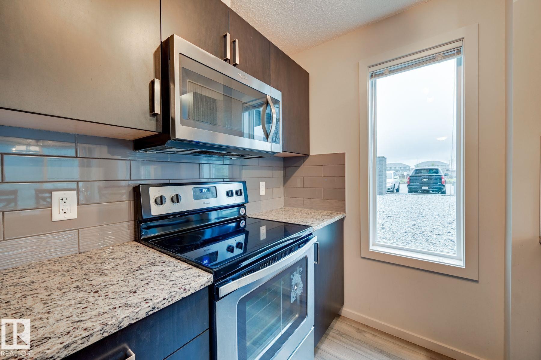 101 142 Ebbers Boulevard, Edmonton, AB - Indoor Photo Showing Kitchen With Stainless Steel Kitchen