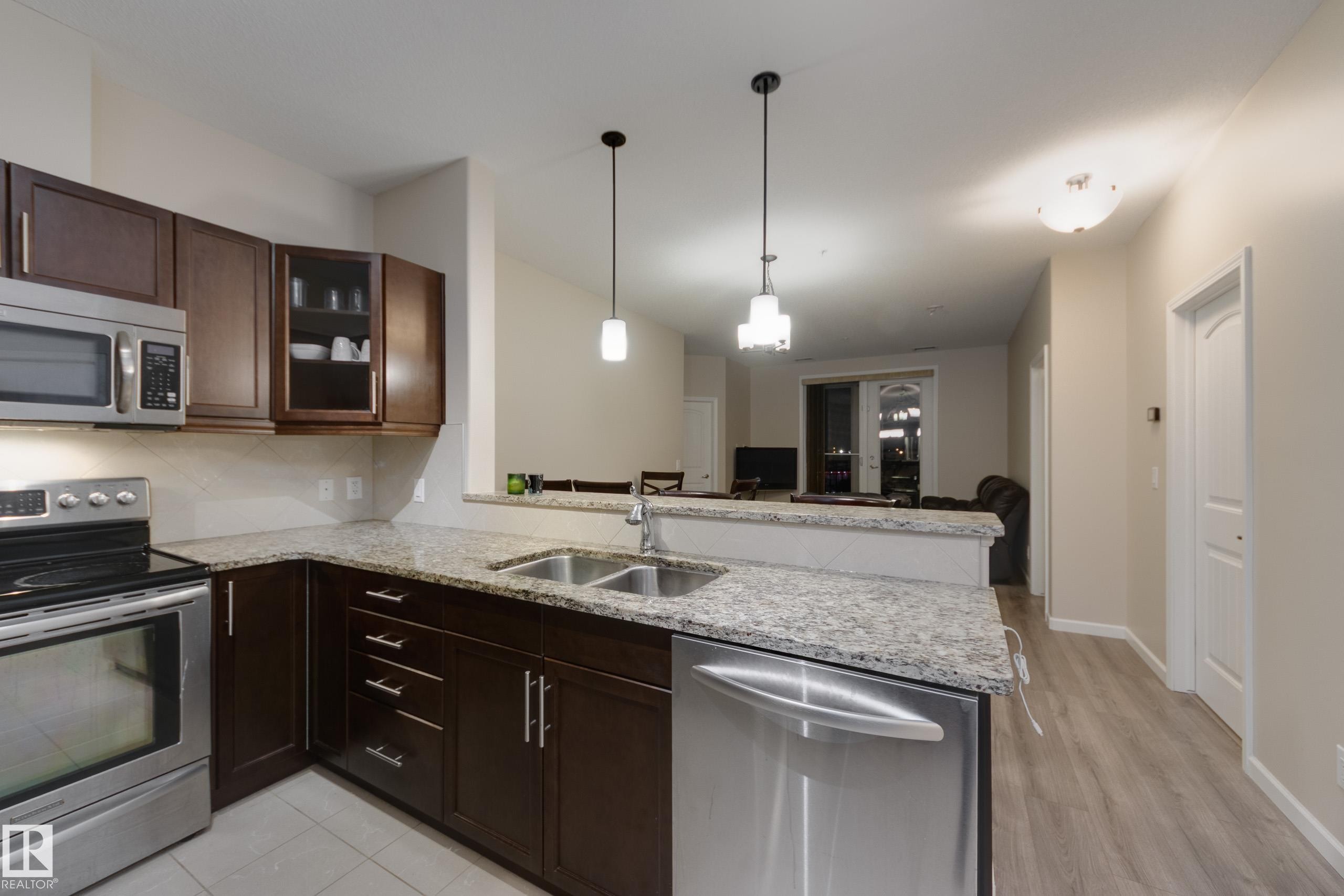 317 6083 Maynard Way, Edmonton, AB - Indoor Photo Showing Kitchen With Double Sink With Upgraded Kitchen