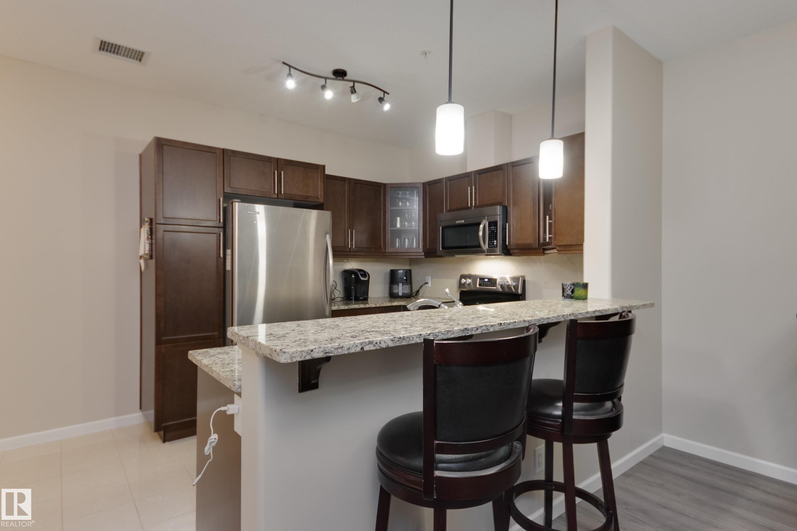 317 6083 Maynard Way, Edmonton, AB - Indoor Photo Showing Kitchen With Upgraded Kitchen